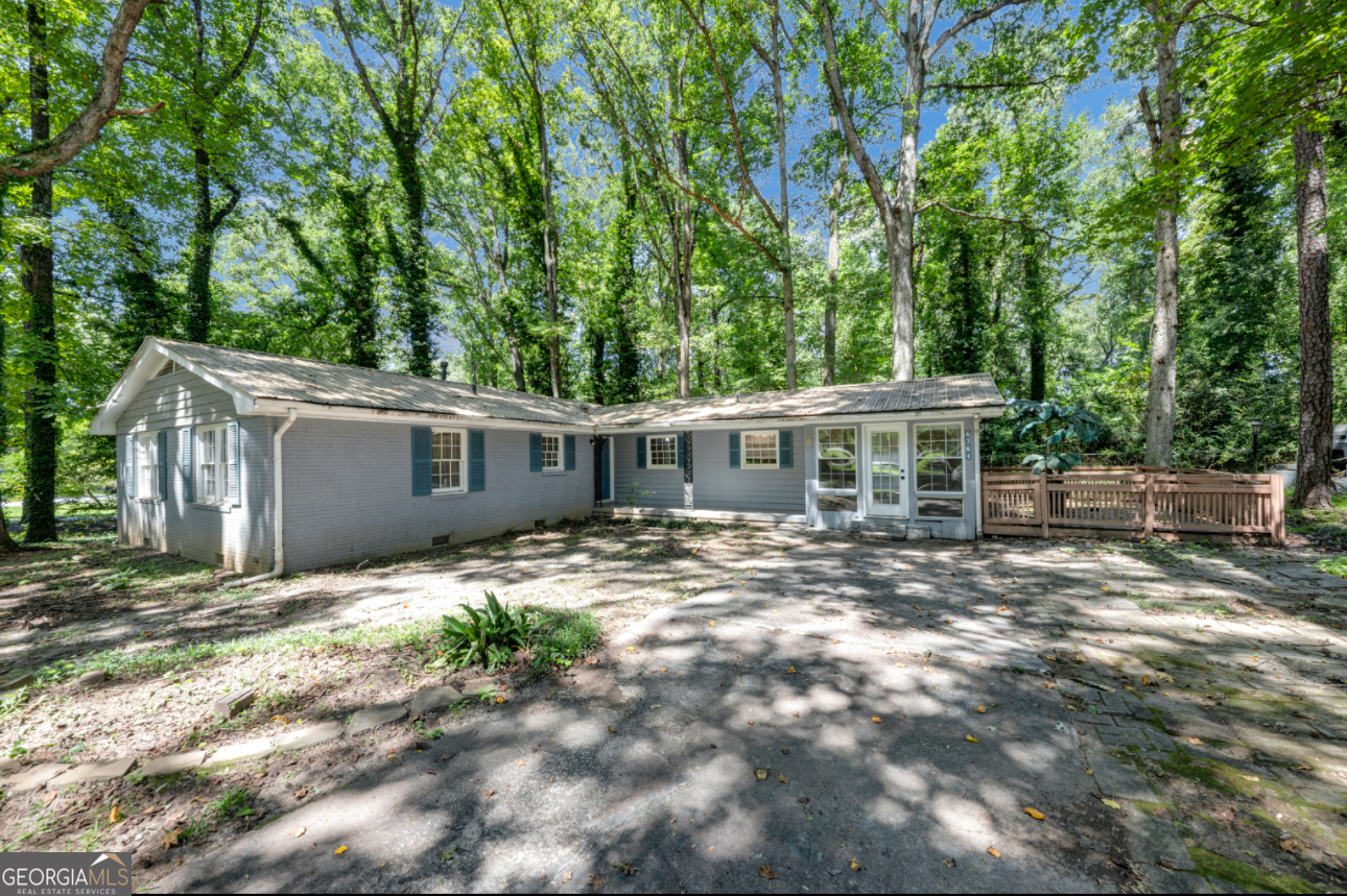 Charming 1962 Classic - A Fixer-Upper with Endless Potential! Welcome to this vintage gem nestled in a quiet, established neighborhood. Built in 1962, this 3-bedroom, 2-bathroom, 1,474 sq ft home offers the perfect opportunity for investors, DIY enthusiasts, or homeowners ready to restore a classic to its full glory. Step inside to find original hardwood floors, mid-century design features, and spacious living areas with tons of natural light. The kitchen and bathrooms are ready for your custom renovation ideas. With solid bones and a generous floor plan, this home is the ideal canvas for a full makeover. Outside, you'll find a yard with mature trees-perfect for creating an outdoor oasis or expanding the living space. backyard offers additional renovation flexibility. This home is brimming with opportunity. Whether you're looking to flip, rent, or renovate for your forever home, don't miss this incredible value!