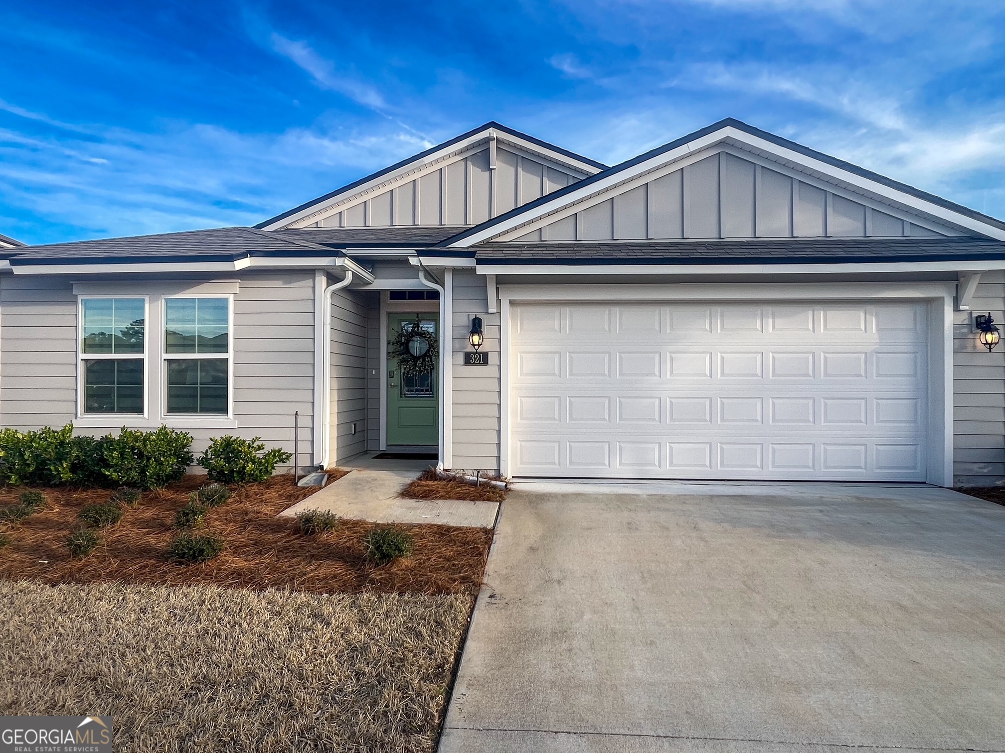 Step into your dream home with this beautifully crafted 4-bedroom, 2-bath, 1,864 sq. ft. residence in the desirable Osprey Cove neighborhood of Saint Mary's, GA. Nestled in a serene, gated golf course community, this home offers tranquil lake views, scenic walking trails, and a peaceful atmosphere that will make you feel right at home. Designed for modern living, the single-story floor plan seamlessly blends the kitchen, dining, and living areas, creating the perfect space for both relaxation and entertaining. At the heart of the home, you'll discover a chef-inspired kitchen with pristine white cabinetry, quartz countertops, a stylish backsplash, and premium stainless steel appliances. The large island not only provides ample workspace but also serves as a central hub for socializing and hosting guests. Step outside through the sliding glass door to the screened-in lanai, where you can enjoy year-round outdoor living while taking in the peaceful lake view. The oversized main suite offers a private retreat, featuring a spacious walk-in closet and a luxurious bathroom with a dual vanity, perfect for unwinding after a long day. The additional three bedrooms are generously sized and feature ceiling fans, with one room offering the flexibility to serve as a home office or gym. Custom zebra shades throughout the home provide both privacy and style, elevating the overall aesthetic. Situated in the sought-after, quiet gated community, this home provides easy access to the golf course, walking trails, and a relaxing environment. With attention to detail and quality finishes throughout, this home is essentially brand new and ready for you to move in and make it your own. Homeowner is a Georgia licensed real estate agent. Don't miss the chance to own this stunning property, schedule your tour today!
