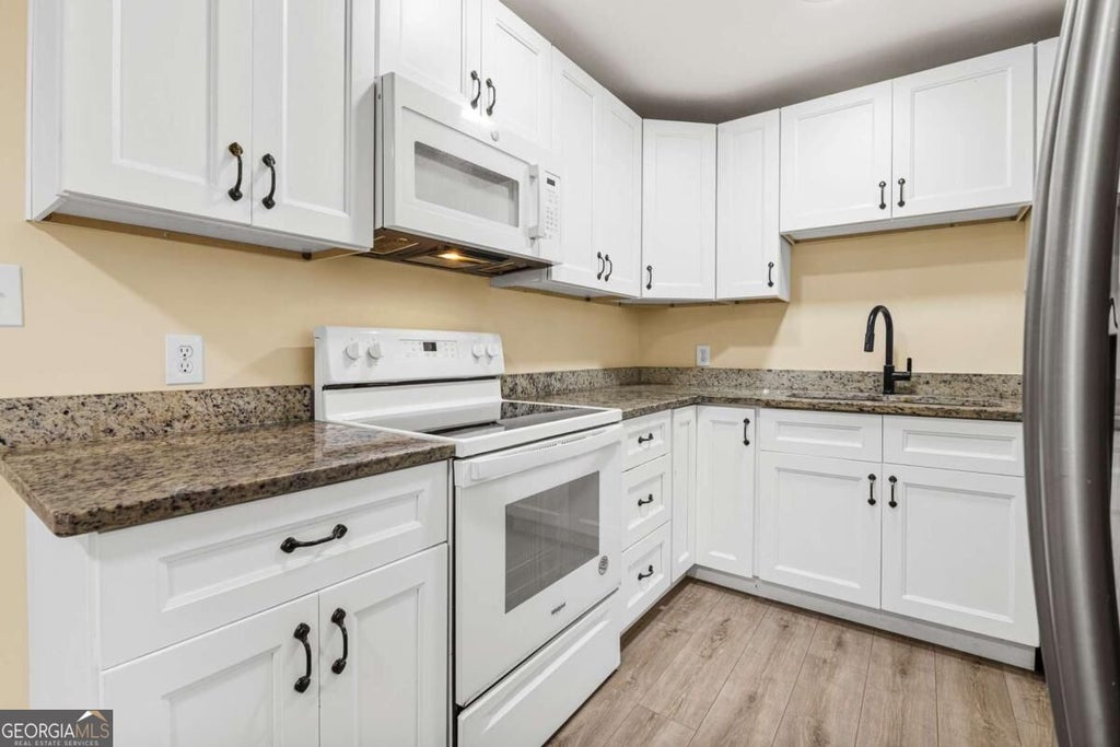 Photo of 349 Roxbury Dr, Riverdale, GA 30274 (MLS # 10868876)