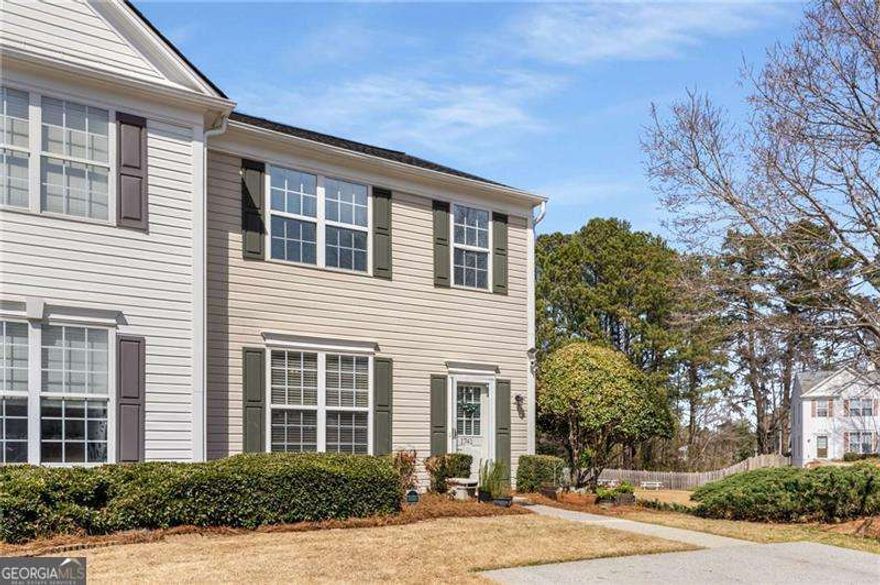 Welcome to this beautifully maintained corner-unit townhome in the desirable Cedarlake community of Kennesaw. From the moment you step inside, you'll feel the calm, welcoming energy of the open floor plan, perfect for entertaining friends or enjoying cozy evenings at home. The kitchen is bright and inviting, with granite countertops, stainless steel appliances, and plenty of cabinet space. You'll love cooking meals while still being part of the conversation, as the kitchen opens seamlessly to the family room and dining area.  Upstairs, you'll find a peaceful owner's suite along with two additional bedrooms, ideal for guests, family, or a home office. Step outside to your private fenced patio and take in the serene view of the pond and the soothing sound of the fountain-a rare and tranquil setting for your morning coffee or evening glass of wine. You can also enjoy the community's outdoor spaces by sitting at one of the benches overlooking the water or having lunch at the picnic tables steps away.  This end-unit offers extra privacy and a spacious feel with open green space beside it. Additional features include a whole-house water filtration system, a 4-year-old roof, and the convenience of an included washer and dryer, so you can move right in and start enjoying your new home.  With its prime location near Whole Foods, restaurants, shopping, Kennesaw Mountain, I-75, and Kennesaw State University, you'll have everything you need close by. Grab your favorite pair of sneakers and head to one of the scenic trails at Kennesaw Mountain to enjoy this beautiful time of year and watch the leaves change colors-just one of the many perks of living here.  If you're looking for a tranquil home at a great price that offers comfort, convenience, and charm, this one might be the perfect fit.