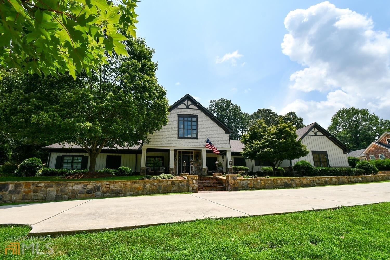 Designed for entertaining family and friends, this beautiful home is in the heart of downtown Gainesville. The main floor boasts 5 large bedrooms, 4 full baths and 2 powder rooms, Chef's kitchen has beautiful granite countertops, stacked stone encased gas stove, 3 ovens, 2 dishwashers, oversized island with seating, separate coffee bar and mud room. Large family room with vaulted ceilings, 2-sided fireplace and a wall of windows that welcome in the sunlight. Upstairs has 1 bedroom, 1 full bath, private office, powder room, rec room and storage space galore. The oversized screened porch has wood burning fireplace and plenty of space to spread out. Private backyard with beautiful saltwater pool, basketball court and plenty of space to run and play. Other details: new roof, copper gutters, 3 car garage, professional landscaping and more.