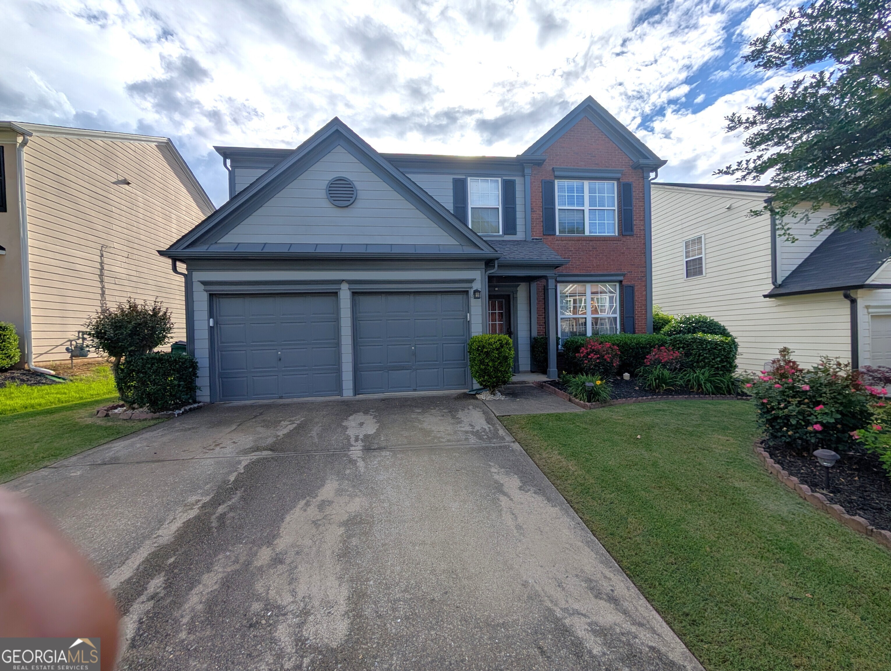 Are you seeking exceptional value in an unparalleled location? Your search ends here! Welcome to this delightful 3-bedroom, 2.5-bathroom residence nestled within the coveted Kingsgate Community. Opportunities like this are rare at this price point! It's tough to find a home with similar features and benefits in such a prime location. Nestled in the heart of Woodstock, this home is a short drive away from Downtown Woodstock, and is adjacent to Downtown Roswell, Downtown Alpharetta, and Milton-each known for their excellent dining, lively festivals, shopping, and breweries. Plus, with easy access to I-75 and I-575, commuting is a breeze. The exterior has been recently painted. Inside, the kitchen has a huge that open to a spacious two-story great room with a fireplace, creating a bright and airy atmosphere. The main level also includes a separate dining room, a flex space, and a half bath-all featuring LVP ant porcelain flooring in the kitchen. Upstairs, you'll find three generously sized bedrooms and two full bathrooms. The master suite features vaulted ceilings, a large ensuite bathroom, and a walk-in closet. Two additional guest bedrooms provide plenty of space, and the hall bath offers double sinks for added convenience. A wonderful laundry room is thoughtfully located just outside the master bedroom. Step outside to a fully fenced in yard. The backyard is sodded, level, and has an extended patio, providing plenty of space for entertaining. Kingsgate is a fantastic community featuring two pools, multiple tennis courts, a playground, and a basketball court. This is an incredible opportunity to own a home in a prime location with fantastic amenities. Come see it for yourself-you'll be glad you did!