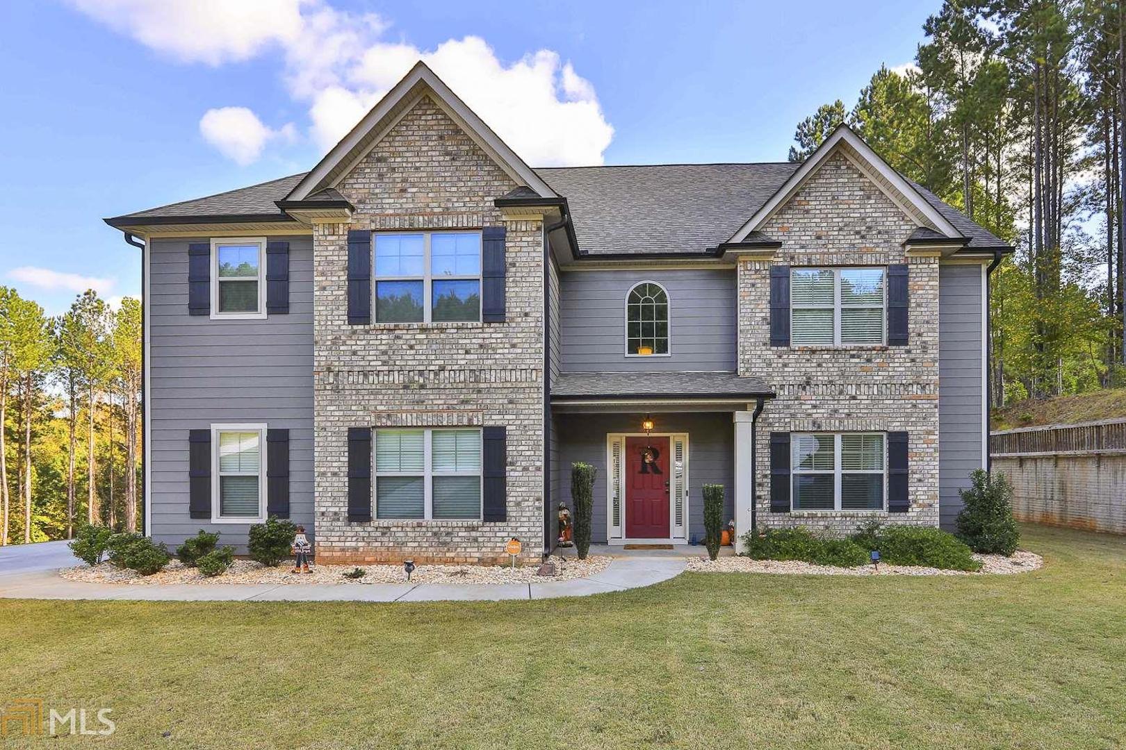 Over 4000 sf home on a 2.5 acre cul-de-sac lot. Main floor guest bedroom with full bath and walk in closet. Natural light and two story foyer and living room welcome you in this beautiful home. Gourmet kitchen with double wall ovens, gas cooktop, and stainless steel refrigerator. Center island for food prep. Huge walk in pantry. Kitchen and Breakfast Room open into Family Room with stacked stone fireplace. Upstairs is owners suite with fireplace. Master bath with tile shower, dual sinks, 6’ soaking tub and large walk in closet. Three additional bedrooms, one with private bath. Loft space for office or study area. Outside space may just be the best part - Enjoy the game and fall evenings under the covered porch with stacked stone fireplace. Salt water pool will be waiting on you when Georgia summers return.