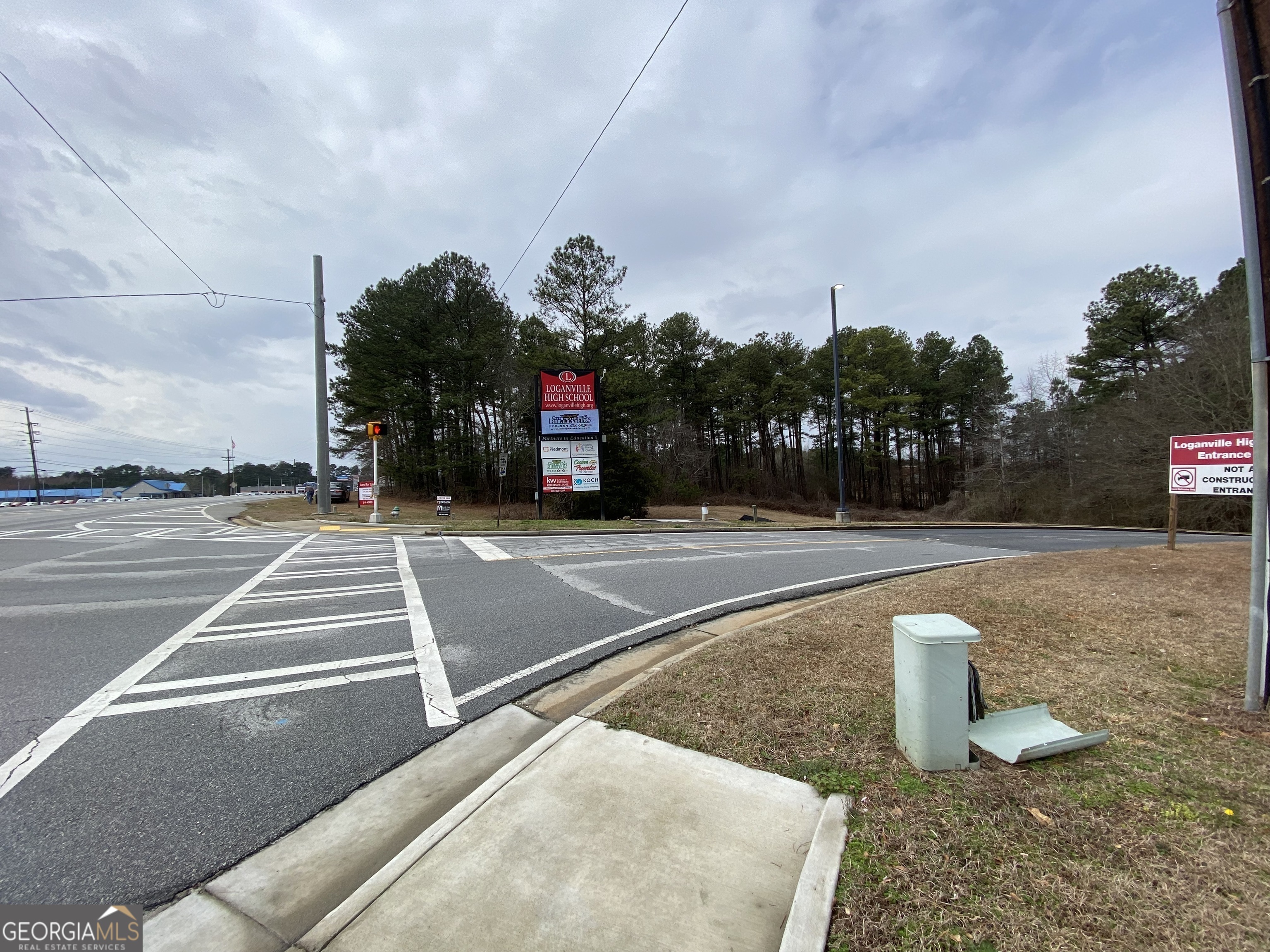 Don't miss this opportunity to own an ENTIRE CORNER on Highway 78 in Loganville, right in front of Loganville High School. This property is being jointly marketed with another parcel, giving access to both PRIME Highway 78 road frontage AND rear access from Trident Trail. Both properties total 4 acres (roughly 2 acres each). Property has many potential uses, including retail, restaurant, office space, etc., and sits at an intersection with high traffic volume. Whether you have customers that require ample parking, or if you need access to a back area for product delivery, check out both parcels today! Both parcels are zoned A-1 and R-44, so buyer will need to work through the rezoning process. With multiple large employers in the area, including RIVIAN, TAKEDA, WALMART, and HITACHI, along with continued growth in the Atlanta suburbs, this is a can't-miss opportunity! *Both parcels are $1,000,000 purchased together; $500,000 each purchased separately. Cross-reference with FMLS 7454844/GAMLS 10376768.