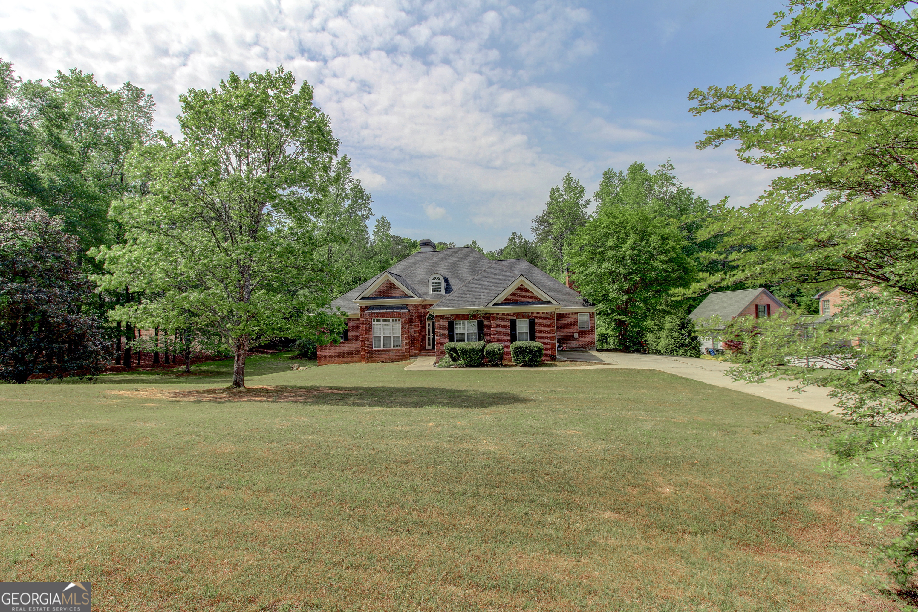Endless potential in this spacious 4-sided brick home with full, partially finished basement. Just needs a little TLC to become something truly special. Enjoy the oversized deck and fenced backyard-ideal for entertaining, relaxing, or play. The main level features a primary suite and two additional bedrooms connected by a Jack-and-Jill bathroom. The open-concept family room offers high ceilings and direct access to the deck for seamless indoor-outdoor living. The kitchen includes custom cabinets, a breakfast area, and a cozy keeping room with fireplace and built-in bookcases. The basement provides two additional finished rooms perfect for an office, gym, or guest space. There's also a large entertainment area complete with wet bar, plus walkout access to a terrace that's ready for your personal touch. This property is being SOLD AS-IS! Don't miss this opportunity-schedule your showing today and envision the possibilities!