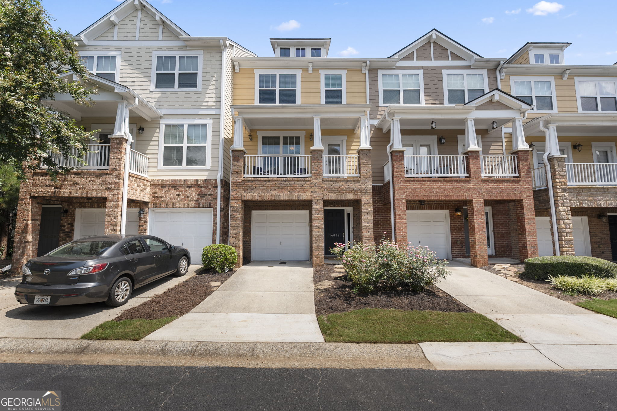 Welcome to this spacious home with 4 bedroom 3.5 bath townhome in Wyndham. It is in an excellent location and school district. This home has tons of curb appeal with stacked stone accents and a large covered porch in the front plus a deck in the back. Inside has a bedroom and full bathroom on the lower level and the bedroom opens to a concrete patio in the back. This could double as a fantastic home office. The second level has a large great room with cozy fireplace, half bathroom, and kitchen that opens to the dining room. The kitchen has timeless white cabinets, quartz countertops, and a trendy but classic herringbone pattern backsplash. The kitchen has a pantry, breakfast bar, and stainless steel appliances. The upper level has 3 bedrooms, 2 full bathrooms, and the laundry room. The master bathroom has a separate shower and soaking tub. This home has an excellent layout with plenty of space for everyone. Unlike many of the other units in this community, this one has a full bathroom on the lower level making it way more flexible. You don't want to miss this one!