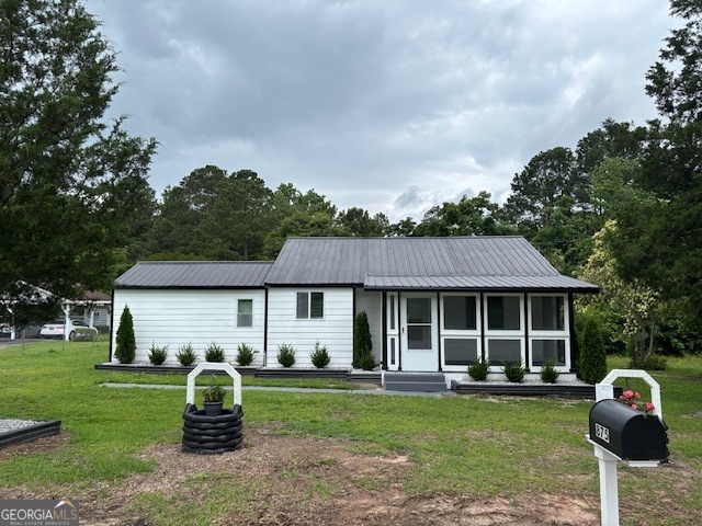 Welcome to this beautifully refurbished 3-bedroom, 2-bathroom home offering 947 sq.ft. of thoughtfully updated living space on a spacious .42-acre lot. Located just 1 mile from I-20 and approximately 25 minutes to Augusta, this property is ideal for commuters or anyone seeking a peaceful setting with convenient access to nearby amenities. This home has been completely renovated and features: Durable vinyl LVP flooring throughout New HVAC system for year-round comfort Stylish new kitchen appliances perfect for modern living Brand new metal roof for long-lasting protection and low maintenance Enjoy outdoor living with a screened front porch perfect for morning coffee and a covered rear porch ideal for entertaining or relaxing in the shade. A detached outbuilding offers extra storage or workspace. Don't miss this move-in ready home that blends modern upgrades with cozy charm - all in a convenient location!