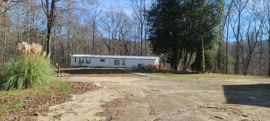 LOOKING FOR A AN INVESTMENT/RENTAL PROPERTY? LOOK NO MORE. SINGLE WIDE MOBILE HOME ON 3.30 ACRES. ACREAGE IS COMPRISED OF TWO LOTS. MOBILE HOME ITSELF IS SITUATED ON LOT 31 CONTAINING 2.13 ACRES. LEAVING THE REMAINING ACREAGE OF 1.17 ON LOT 30 WHICH HAS A 27X30 GARAGE/STRUCTURE THAT WILL ALSO NEED SOME REPAIRS. NO VALUE HAS BEEN GIVEN TO MOBILE DUE TO REPAIRS NEEDED THAT SELLER CAN NOT DO BECAUSE OF TIME CONSTRAINS. LAND LAYS WELL WITH A CREEK ON THE BACK BOUNDARY OF PROPERTY.  DEADLINE TO SUBMIT OFFERS IS 01/15 @ 1PM.