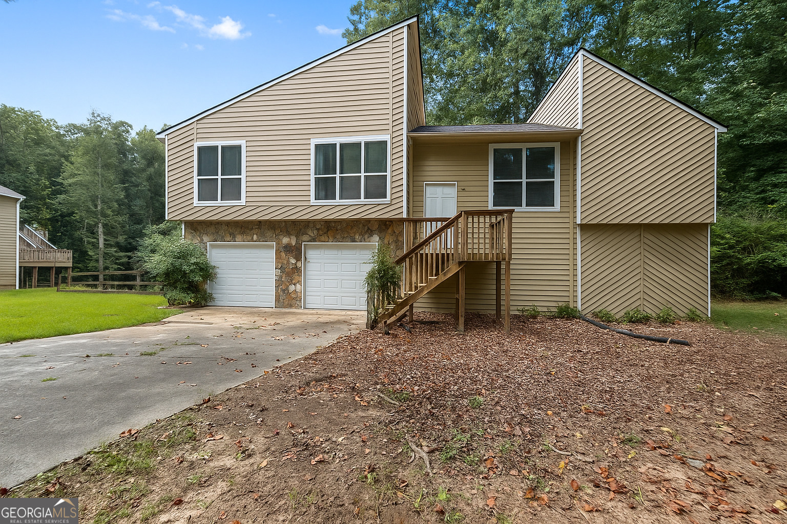 Welcome to this beautiful 3-bedroom, 2.5-bath home boasting 1,973 sq ft of living space, nestled among the trees. Step inside to discover a serene and tranquil ambiance, surrounded by nature's beauty. The open floor plan creates a spacious and inviting atmosphere, and hardwood floors throughout, perfect for relaxation and entertaining. The modern kitchen features sleek appliances and ample counter space, ideal for cooking and gatherings. Retreat to the tranquil master suite with its private bath, while two additional bedrooms offer comfort and versatility. With its peaceful setting among the trees, enjoy the large open porch, this home provides the perfect escape from the hustle and bustle of everyday life. Just minutes from parks, Lake Acworth, shopping, dining, and I-75