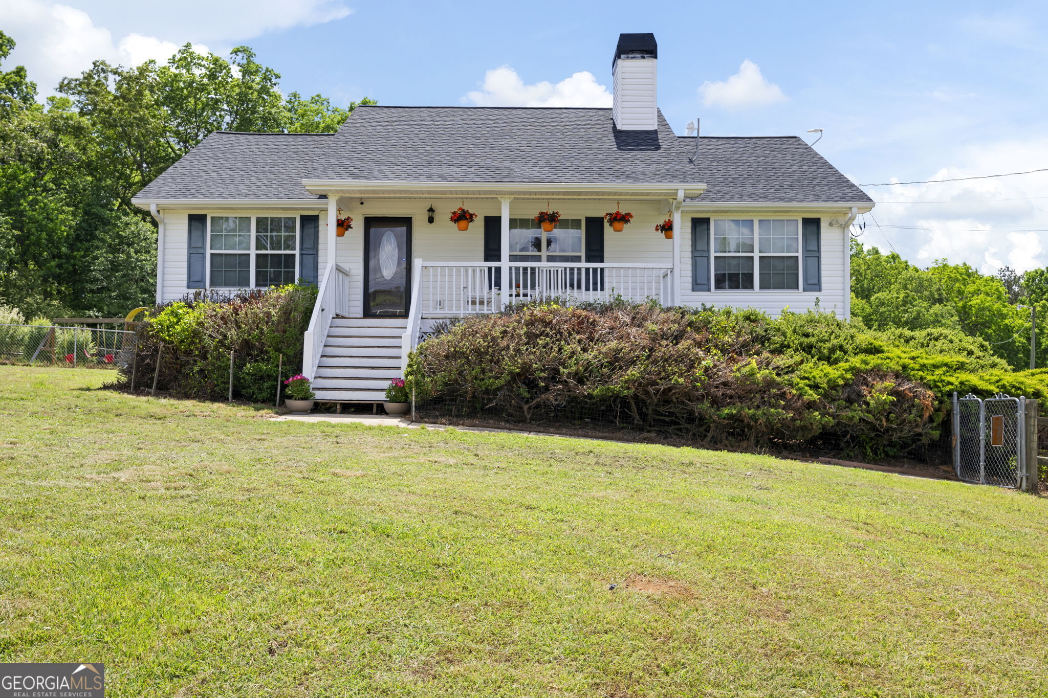 FARM-READY GEM WITH POOL, PASTURES & WORKSHOPS - ALL ON 5.19 ACRES - 3 or 4 BEDROOMS, 2.5 BATHS - 2,680 SQ FT - RAISED RANCH ON FULL FINISHED BASEMENT - GAME ROOM WITH CUSTOM BAR & POOL TABLE - 36' x 18' SALTWATER POOL - PERGOLA - FLOWER GARDENS - WORKSHOP WITH 220V OUTLETS - 30' x 25' BARN WITH TWO 12' AWNINGS - 4 PASTURES (3 FULLY ENCLOSED) - FARM-READY PROPERTY - NEW ROOF Tucked away on over five peaceful acres in the heart of Buchanan, Georgia, this inviting home is the perfect blend of comfort, space, and countryside charm. Built in 2006, the home offers 2,680 square feet of thoughtfully designed living space, ideal for those craving a slower pace with room to spread out. The welcoming front porch and traditional exterior give a warm, down-home feel, while the oversized lot offers both privacy and potential. Step inside to find three generously sized bedrooms and two and a half bathrooms, with a layout that supports both everyday living and entertaining. A cozy fireplace anchors the main living area, complemented by a mix of carpet, tile and durable vinyl flooring throughout. The finished basement adds even more versatility-featuring a spacious game room with a custom-built bar that stays with the home, perfect for entertaining friends or relaxing on weekends. Outdoors is where this property truly shines. Dive into the show-stopping 36' x 18' computerized saltwater in-ground pool, complete with an anchor cover system for safety and easy maintenance. The nearby cabana provides the perfect shaded retreat for summer lounging. Multiple garden areas invite you to grow your own produce or flowers, while the fully equipped workshop with 220-volt outlets is a dream for DIYers, mechanics, or hobbyists. Animal lovers and hobby farmers will feel right at home with the 30' x 25' barn featuring two 12-foot awnings, ideal for equipment or livestock shelter. There are four pastures-three fully enclosed and one partially enclosed-ready for horses, goats, or any animals you'd like to bring. The property was even listed as a farm a few years ago, making it a true hidden gem for those looking to embrace country living with agricultural possibilities. Whether you're starting a homestead, raising a family, or simply want room to breathe, this property offers a rare opportunity to live the rural lifestyle without sacrificing modern comfort. Schedule your private tour today and see why this one-of-a-kind country retreat won't last long-bring your boots, your animals, and your vision for the good life!