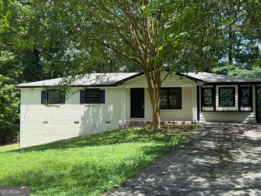 Nestled quietly on the point of the cul-de-sac, this beautifully renovated 4 bedrooms, 2 bathrooms ranch sits on half of an acre. The light-filled home features an open concept that seamlessly flows from the living room with gorgeous flooring, to the dining area, then the updated kitchen with stained cabinets, newer stainless-steel appliances. The primary suite offers a serene retreat with views of the backyard. A Bonus room previously used as an office leads to the private, fenced backyard with two wooden sheds for additional storage space. Plus, a ONE-year old roof provides for extra peace of mind. This surprisingly quiet neighborhood without HOA restrictions (!) is located just minutes away from Wellstar Cobb Hospital and the bustling EW Connector. A fantastic opportunity in a prime location- Make this home yours today!