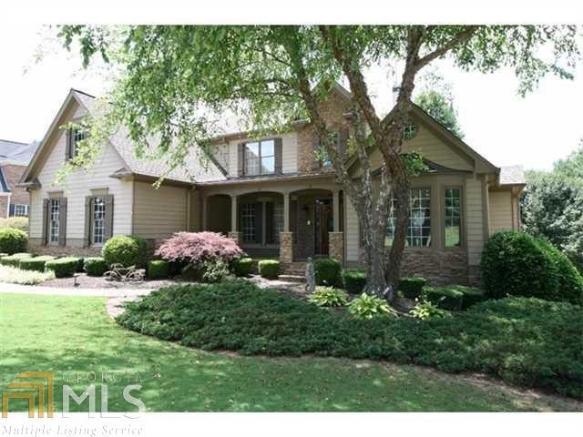 Private manicured setting w/spectacular golf views of 11th green from multiple outdoor living spaces. Great for entertaining w/full theater rm, gaming area, stone wet bar, fireside living & bath on terrace. Extensive stone work in & out! Open transitional plan for party flow w/2-story stone fireplace & built-in cabinetry in grand rm. Soaring wood beam ceiling in main level study. 2 BD on main including master retreat! Formal dining + butlers pantry. Granite & stainless kitchen w/shaker cabinets & copper-style pulls. 3 car garage on main + driveway to 1 car in terrace.