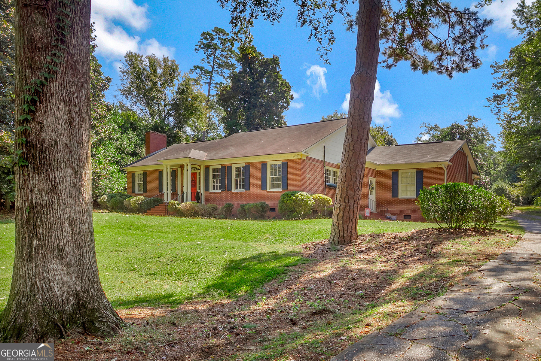 This brick home on 1.6 acres in beautiful Shirley Hills has been totally updated! Hardwood floors throughout, fireplace in the living room, formal dining room, updated kitchen with stainless appliances & quartz counter tops,bar top dining, sunroom with built in area for washer/dryer and back patio. Main level has 3 bedrooms, one of which has been converted to a walk in closet. Owners bedroom has full bath, another full bath in hallway. Upstairs features 4th bedroom and 1/2 bath. Enjoy the deer in your private backyard. Nice storage building. Furniture can be negotiated
