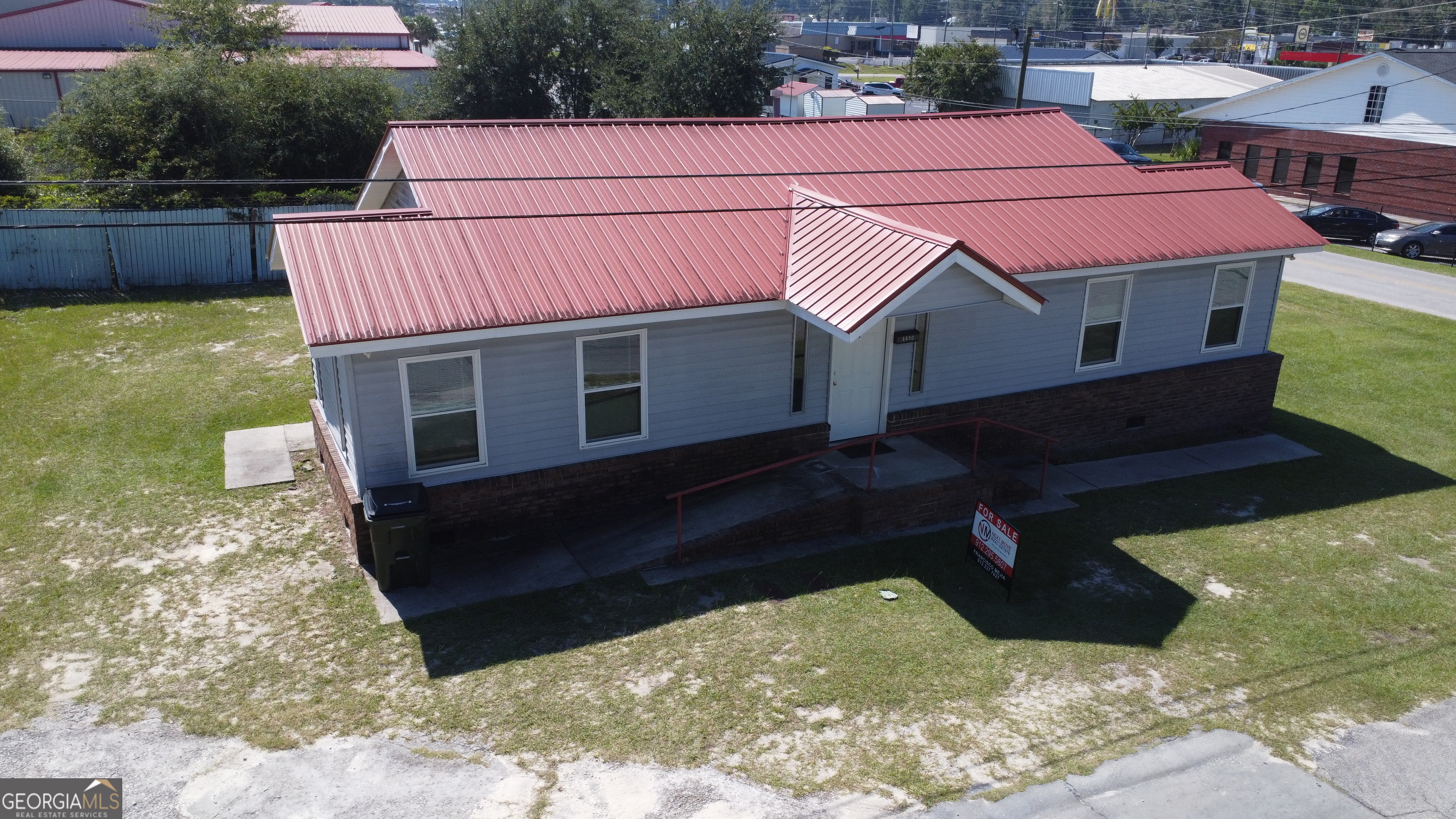 Prime Commercial & Residential Opportunity! This unique property offers two income-producing units in a fantastic location. Unit A is currently an operating salon, while Unit B is a 1-bedroom, 1-bath apartment generating steady rental income. Unit B has been updated with a new kitchen, flooring, electrical, and a renovated bathroom with shower and vanity. It also features its own private driveway. The property boasts a strong rental history, low maintenance, and excellent income potential. Don't miss out on this rare opportunity - call today to schedule your appointment! Listing agent is related to the seller.