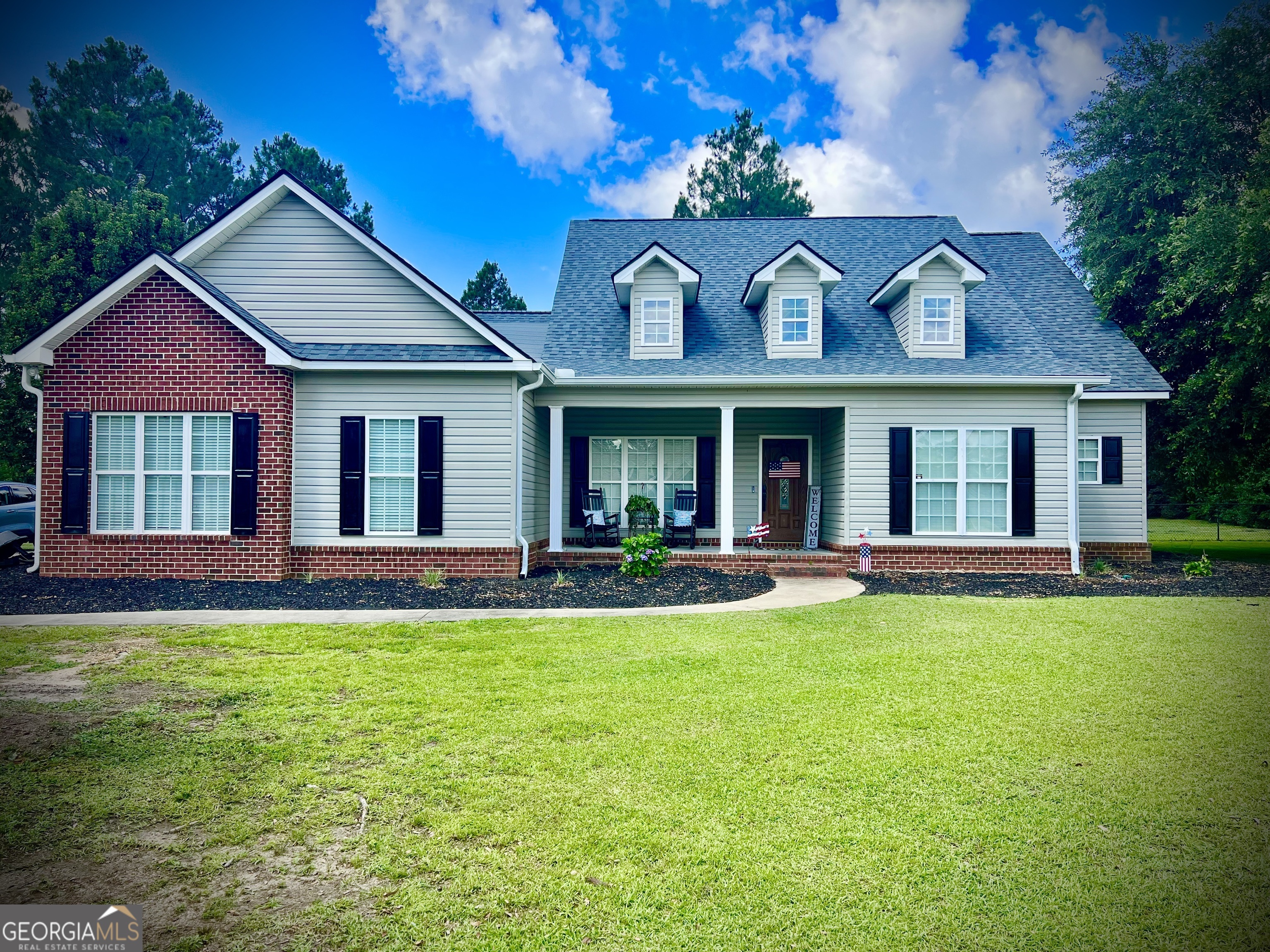 THIS HOUSE IS NOT FOR RENT. PLEASE BEWARE OF SCAMMERS. Well-Maintained Cape Cod on 1.1 Acres in Live Oak Subdivision! This charming 4-bedroom, 3-bathroom Cape Cod-style home offers 2,149 sq ft of thoughtfully designed living space on a spacious 1.1-acre lot with a large fenced backyard-perfect for pets, play, or gardening. Inside, enjoy beautiful hardwood floors, tile flooring in the kitchen and baths, and an open layout ideal for entertaining. The spacious kitchen features an eat-at counter, recessed lighting, and connects seamlessly to the formal dining room and breakfast nook with built-in desk. The primary suite offers a peaceful retreat with a tray ceiling, double vanities, a jetted tub, separate shower, recessed lighting, and a huge walk-in closet. Additional highlights include a welcoming foyer, covered back porch, friendly front porch, double garage, and access to a community pool and clubhouse. Conveniently located near shopping, restaurants, and medical facilities, this home combines modern comfort with timeless charm-don't miss your opportunity to make it yours! Call listing agent today to schedule your tour!