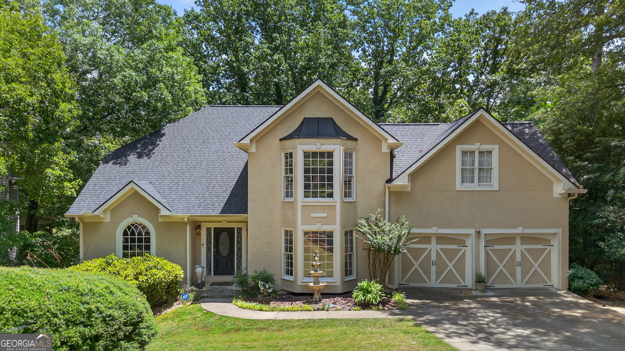Stunning Executive Home with Finished Basement & Backyard Oasis! Welcome to your dream home! Tucked away on a private lot, this 5-bedroom, 4-bath custom home is the perfect blend of classic charm and modern sophistication. From the moment you pull into the driveway, you'll fall in love with its stately curb appeal, elegant architectural details, and beautiful manicured landscaping complete with a charming fountain centerpiece and carriage-style garage doors. Step inside to soaring ceilings, tons of natural lighting, and timeless hardwood floors. The chef's kitchen is complete with granite countertops, a large center island, gas cooktop, and a wall of built-in cabinetry perfect for entertaining or everyday living. The luxurious owner's suite features a spa-like bathroom with a frameless glass shower, soaking tub, dual vanities, and custom tilework throughout. Need space for guests or hobbies? You'll love the fully finished basement! Completely renovated a couple years ago it offers a home theater, billiards/game room, and custom wet bar-the ultimate hangout zone! Outdoors, enjoy peaceful mornings or weekend BBQs in your private backyard retreat, shaded by mature trees and full of potential for gardening, play, or relaxation. Highlights Include: Finished basement with game room, bar and pool table! Vaulted ceilings & abundant natural light Designer kitchen & bathrooms Double garage with carriage doors Prime location, plenty of space, low HOA fees and