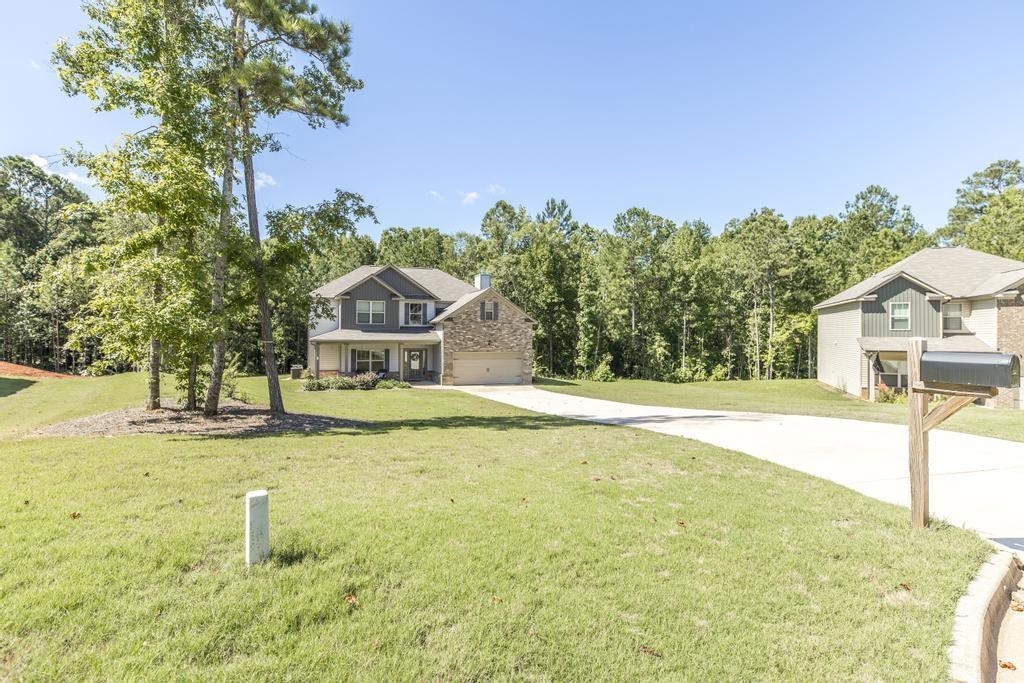 2 years new and located on a 1.11 acre culdesac lot! This beautiful & spacious home features an open floor plan on the main level with 9 foot ceilings, luxury vinyl plank flooring, formal living room with wood burning fireplace & formal dining room. The lovely kitchen is complete with granite countertops, tile backsplash and stainless appliances. The enormous master suite features vaulted ceilings, huge master closet, master bath with dual vanity, garden tub and separate shower. All 3 additional bedrooms are well appointed with vaulted ceilings as well. This opportunity is hard to find so you better call today!