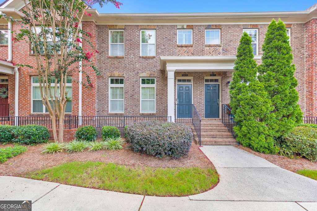Experience refined townhome living in the heart of Johns Creek! This beautifully maintained 2 bed / 3.5 bath townhome is nestled in the highly sought-after gated Abberley Towneship swim/tennis community, just steps from the brand-new Morton Road Park and located in a top-rated school district. Hardwood floors, crown molding, and recessed lighting welcome you into the spacious main level, which features a separate dining room and an updated kitchen with a center island, stone countertops, stainless steel appliances, and a sunlit breakfast nook. The fireside family room offers built-in bookshelves and opens to a bright flex space perfect for a home office or reading room. A private rear deck is ideal for relaxing or entertaining, and a half bath completes the main level. Upstairs, the oversized primary suite impresses with tray ceilings, a large walk-in closet, and a spa-like ensuite with double vanities, a whirlpool tub, and a separate shower. A secondary bedroom with its own private ensuite bath and walk-in closet, plus a conveniently located laundry closet, round out the upper level. The finished terrace level offers a large bonus room ideal for a media room, playroom, or potential third bedroom, along with a full bathroom and access to the attached 2-car garage. Enjoy the peace of mind and amenities of a gated community with a pool and tennis courts, all just minutes to Avalon, Downtown Alpharetta, GA-400, Ocee Park, Newtown Park, and fantastic shopping and dining options. This one checks all the boxes-don't miss it!