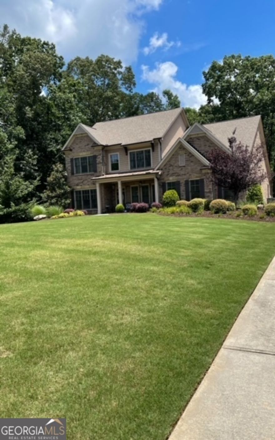 Welcome to this beautiful home located on one of the best lots in The Preserve at North Valley Community. This beautiful home has the perfect setup and open floorplan for daily living and entertaining. Upon entry into the home, to your right you will find a room that can be converted back to a dining room by removing the wall in between the ButlerCOs Pantry. This beautiful home overlooks a large back yard that allows privacy. Spacious master suite on the main with a beautiful his and hers bathroom. The full unfinished basement has an open plan that can be customized to include a kitchen, bathroom, bedroom, office, playroom, etc. Just a few minutes away from Georgia 400, golf, dining, shopping, etc. WELCOME HOME!!