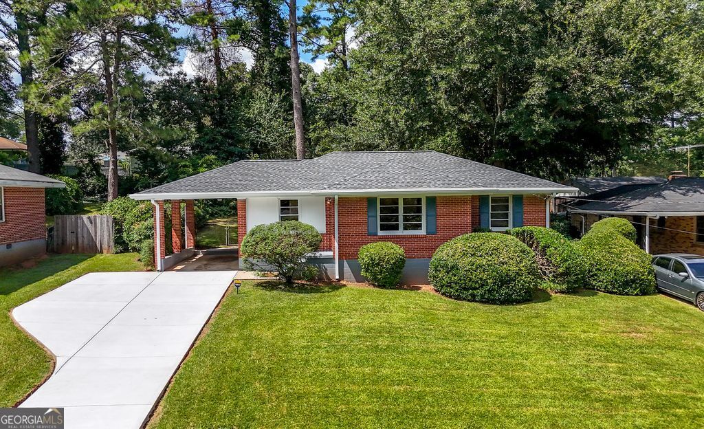 Charming Brick Ranch near East Lake Golf Course! Welcome to this beautifully maintained brick ranch home, nestled on a deep, oversized lot in a highly desirable location. Just a short stroll to the scenic Lake at Barker Bryant Park and the prestigious East Lake Golf Course, this home offers the perfect balance of serenity and convenience. Step inside to discover the warmth of original hardwood floors throughout and a thoughtful layout featuring both a formal dining room and a sunlit kitchen, ideal for family meals and entertaining. With three spacious bedrooms, this home provides plenty of room for a growing family or guests. Recent renovations include a new roof, HVAC, fresh paint, and a new driveway, ensuring peace of mind for years to come. The large, fenced backyard is perfect for outdoor living and features a brick shed with endless potential. Transform the shed into a tiny home, studio, or private office to fit your lifestyle needs. Easy access to Interstates. Minutes to downtown Atlanta, downtown Decatur, shopping, dining, and more. Whether you're looking for a forever home or a smart investment in a thriving area, this East Lake gem is must-see. Schedule your private tour today!