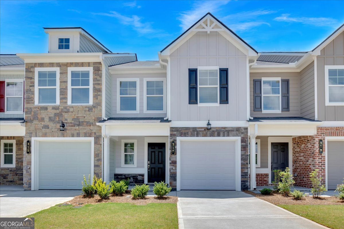 Move-in ready and full of charm, the Oleander at Village Green is a well-designed 3-bedroom, 2.5-bath new construction townhome. The open-concept main level features LVP flooring, a linear fireplace, and a stylish kitchen with painted 36 inch cabinets, granite countertops, tile backsplash, and a spacious island with overhang-perfect for entertaining or everyday living. All kitchen appliances are included for added convenience. Upstairs, the private primary suite offers a cozy sitting area and a spa-like bathroom with tile flooring, double vanities, and a walk-in closet. Located in Adairsville with easy access to I-75, Village Green offers affordable, low-maintenance living with builder warranties and 100% USDA financing options available. Ask about our builder-paid incentives when using our preferred lender.