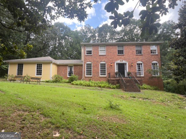 If you are looking for the next great investment or the best deal in East Cobb, this incredibly priced home in Jefferson Township is the one. Priced well below the neighborhood sales of over 800k, this home is ready for your sweat equity or investment dollars. Featuring 4 bedrooms and 3 full bathrooms, this home is full of potential. On the main level you will find a large eat-in kitchen, laundry room, separate dining room, formal living, and a family room with a brick fireplace. There is also a bedroom and full bathroom. The upper level gives you a large owner's suite with sitting area and a bathroom with dual closets, a garden tub/shower combo, dual vanities, and another separate walk-in shower. There are two additional ample sized bedrooms that share a large bathroom with vanity room and separate toilet and shower room. There is even a full unfinished basement with tall ceilings for even more potential. The home has had all the siding replaced with James Hardie fibre cement, has a newer roof, and updated HVAC system. While this home is perfect for the savvy investor, it does qualify for financing offers. This home is being sold "as-is".