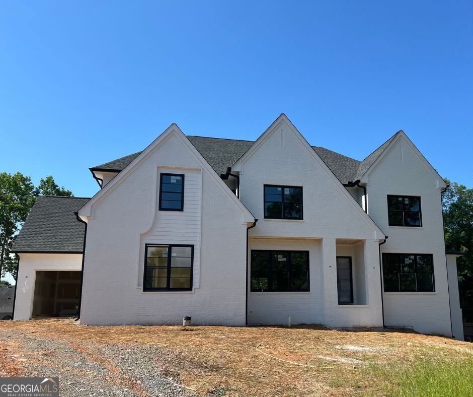 Exclusive opportunity to own your dream home in the sought after Walton school district of East Cobb! With a scheduled July 2025 completion, this beautiful and stately luxury property will be ready for summer and can still be customized with your hand picked design selections including tile, flooring, countertops, and light fixtures. The plan features a transitional style front exterior blended with modern elegance. The steel front door takes you into the foyer and introduces you to the expansive 2 story main level and is highlighted by a remarkable kitchen featuring Thermador appliances, quartz countertops, island and a prep kitchen, all overlooking the the open great room space. Don't miss the office space as well! The home uniquely offers dual primary bedrooms on the main and upper levels. Both feature large bathroom suites with separate vanities and oversized closet space. A full finished basement offers amazing flexibility for entertaining guests or movie night. Last but not least, the backyard oasis is highlighted by covered and uncovered patio areas with outdoor fireplace. Act now for this rare opportunity to put your personal touch on the show home of your dreams.
