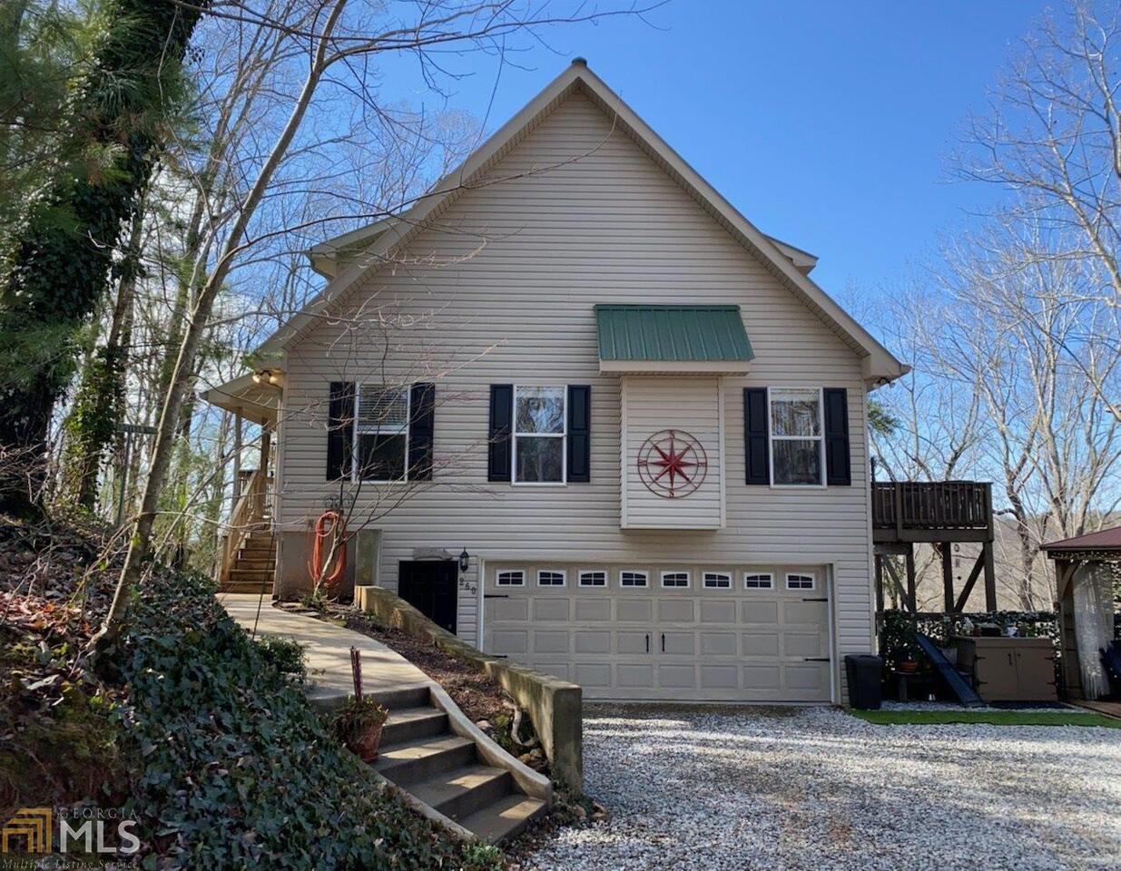 A must see! Mountain Views! Great Location! Naturally Furnished and available! Just 3 miles from downtown Dahlonega on a private paved road you will find the perfect weekender, seasonal, or full-time residence atop Stoney Creek. This Four Bedroom, three full bath charming mountain top home has scenic, all-season views looking due north from the main level outdoor deck. The home offers a number of improvements to include, a complete water filtration system, water conditioner, iron filter, mixed bed sediment filter, and reverse osmosis for the drinking water. Updated kitchen to include new cabinets and granite counter tops. New HVAC System for the main level and upstairs, and in basement two Fujitsu 2-ton dual-zone systems, metal roof, hand-scraped hardwood flooring in master bedroom and loft. An outdoor gazebo with mountain views, perfect for entertaining. The terrace level currently is being used as an Airbnb with a tenant in place through mid-May. A Jack Nicklaus designed golf course awaits you 15 minutes away, plus the charm of downtown Dahlonega, and numerous wineries. The home may be sold completely furnished or unfurnished. All furnishing available through a separate bill of sale.