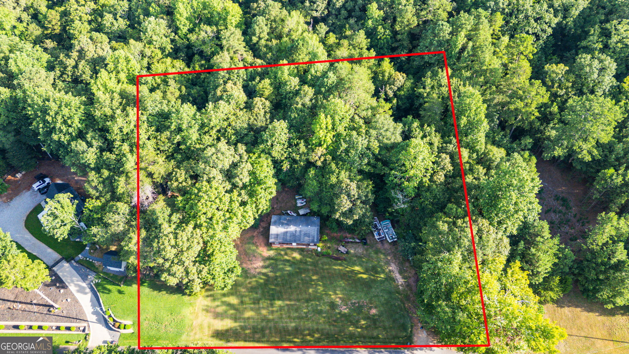 Incredible opportunity to build your dream home on Lake Lanier. With 1.1 acres at your disposal, you have the freedom to design and build the home you have envisioned. Whether it's a sprawling modern retreat or a cozy cottage the canvas is yours to create. Bring your builder and start your lake life. This property is in the highly sought after North End of Lake Lanier in Dawson County. Mary Saphire Road is well known and appreciated for its perfect blend of seclusion, yet convenience to everything needed. This street is a dead end which allows for no through traffic. With no HOA you can bring all of your watercrafts and have ample parking. Your private swim dock is a flat easy walk just steps away, with an open cove leading to large water, for boating, water sports, swimming or just relaxing. The allure of Lake Lanier is waiting. Imagine the possibilities.