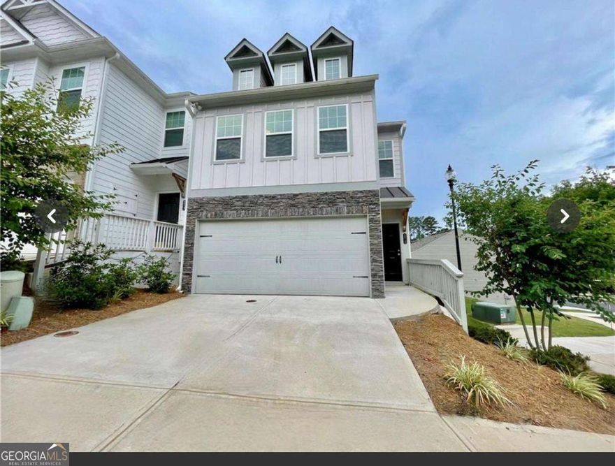 Experience the ease of low-maintenance yet sophisticated laminate flooring throughout the main level, which includes the Family room, Dining area, and Kitchen. The Kitchen features elegant stained cabinetry, a spacious Granite Island, and countertops equipped with stainless steel appliances, including a glass-top range, microwave vent, dishwasher, and full-sized refrigerator. Next to the kitchen, you'll find a large pantry, and a convenient Half Bath is available for guests. Upstairs, the expansive Master suite boasts a tray ceiling and is accompanied by a Master bath with a double vanity, a large walk-in shower, and a separate commode area. The upper level also includes two additional bedrooms, a full hall bath, and a well-placed laundry room. All windows are outfitted with white blinds. This prime location offers easy access to downtown Woodstock, Holly Springs, Woodstock Outlet Shops, Costco, numerous dining and entertainment options, medical facilities, and quick access to major highways.