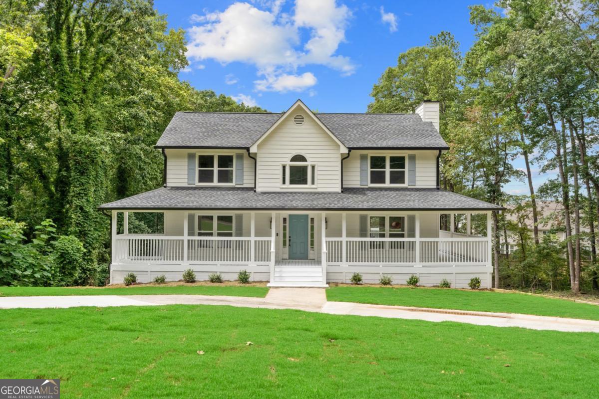 Stunning Remodeled Country-Style Home on 3 Private Acres in Kennesaw - No HOA! Tucked back from the road at the end of a long, newly paved driveway, this beautifully remodeled 4-bedroom, 3.5-bath home sits on 3 rare, open, level acres, giving you the feeling of your own private estate. With a wrap-around porch, expansive decks, and no HOA, this property perfectly blends privacy with convenience. Curb appeal abounds with new sod, fresh landscaping, a newly installed architectural shingle roof, updated windows, and a refreshed deck and porch. Step inside to discover wide, light-stained oak hardwood floors throughout the main level and upper hallway, updated recessed lighting, and an open, flowing floor plan ideal for modern living. The updated kitchen is a chef's dream, featuring crisp white shaker cabinets, quartz countertops, white subway tile backsplash, and brand-new stainless steel appliances. The eat-in kitchen opens to a bright family room with its own fireplace, and both spaces flow seamlessly onto the large wrap-around deck-perfect for entertaining or simply enjoying views of your expansive yard, where deer sightings are common. Upstairs, the primary suite offers a spacious walk-in closet and a beautifully remodeled bathroom with marble-topped double vanities, tiled floors and shower, and a soaking tub. The additional bedrooms are generously sized, complemented by a remodeled hall bath with skylight and an upstairs laundry room for convenience. The terrace level has been fully updated with luxury vinyl plank flooring, a fourth bedroom, and a full bath with marble countertops and new fixtures-perfect for guests, an in-law suite, or additional living space. Practical updates include a new HVAC system, water heater, and garage wiring for an electric vehicle. A large two-story wired shed off the back provides space for another vehicle, a workshop, home gym, or any project you can imagine. Multiple driveways and ample land offer easy parking for cars, RVs, boats, or work trucks. Ideally located near top-rated schools, including North Cobb Christian and Mt. Paran Christian, and just minutes from Kennesaw State University, Downtown Kennesaw, Acworth, Marietta, Kennesaw Mountain, and local parks like Lost Mountain, Oregon, and Swift-Cantrell. Nearby shopping, including Whole Foods, rounds out this exceptional location. This one-of-a-kind 3-acre private lot in the heart of Kennesaw is a rare find and a must-see for those seeking space, privacy, and style.