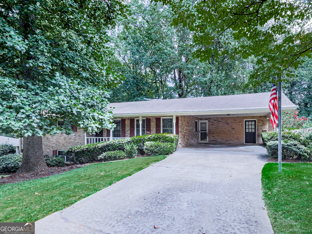 Welcome to this beautifully maintained 3 bedroom, 2.5 bath home in a prime Smyrna location situated in a quiet area on a dead end street. This classic four-sided brick ranch offers the perfect blend of charm and comfort set on a partially fenced, generous sized lot. Step inside to discover a well-maintained residence with hardwood floors throughout the main living space. The home features a versatile open-concept layout, seamlessly blends the kitchen and family areas around a cozy brick fireplace, creating a warm and welcoming atmosphere. The floor plan includes a master and 2 secondary bedrooms with two full baths, a formal dining room, and a separate laundry room off the kitchen. The enclosed sun porch with fan is ideal for enjoying relaxing mornings or peaceful evenings. One of the standout features is the expansive, partially finished basement, which includes a bonus room that can double as an office space of 4th bedroom, and a half bath, as well as additional area with a second fireplace and built-in shelves that could serve as an ideal media, recreation, or workout space. There is also a separate entrance from the backyard. The outdoor space is perfect for entertaining friends and giving pets the room to run. This home provides both privacy and convenience with proximity to the Silver Comet Trail, North Cooper Lake Park, the vibrant Smyrna Market Village. It is located in one of the top rated elementary school districts. All within a short drive to the downtown Atlanta area. Whether you're looking for a place to call home or an investment opportunity in this highly sought-after neighborhood, this property has everything you need. Come take a look before it's gone!