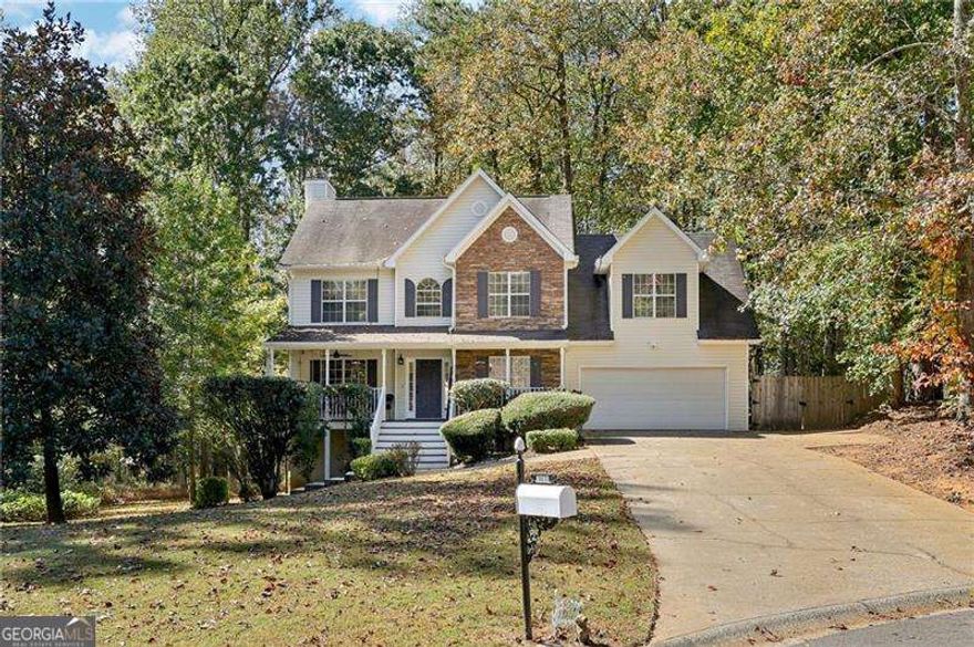 This 4 bedroom 3.5 bath home on over an acre fenced lot in the highly sought-after Coal Mountain area of Forsyth County-where convenience, top-rated schools, and community charm come together. Ideally located just minutes from Matt Town Center and the soon-to-arrive Crossing at Coal Mountain, you'll enjoy exceptional access to shopping, dining, and everyday conveniences right at your doorstep.    Nestled in the established and peaceful Walnut Grove community, residents enjoy fantastic amenities including dual tennis courts, a playground, and a swimming pool. This charming home welcomes you with a rocking-chair front porch, setting a warm and inviting tone. Inside, the kitchen features granite countertops, glazed cabinetry with abundant storage, stainless steel appliances, and a convenient built-in desk area. Enjoy cool evenings by the cozy gas fireplace in the living room, complete with views of the private backyard.    Upstairs, you'll find four bedrooms, including a spacious primary suite with an ensuite bath showcasing dual vanities, tile flooring, and updated fixtures for a fresh, modern feel. The fully finished lower level offers outstanding flexibility with a bonus room and full bath-perfect for a teen suite, guest retreat, home office, or media room.    Situated on over an acre and fenced, the property provides ample room to relax and entertain, featuring a large deck overlooking the private backyard. With a prime location, neighborhood amenities, and space to grow, this Coal Mountain gem is ready to welcome you home!