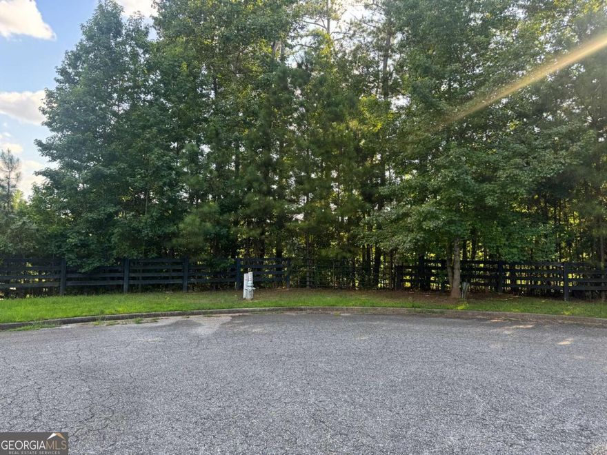Luxury Custom Home Lot - Incredible opportunity to build your luxury dream home on 2+ acres or 6.52 acres (121, 124, & 126 Aaronwood Ct) in one of Alpharetta's most desirable and private cul-de-sac locations. Nestled among mature hardwoods and natural landscape, this gently rolling lot offers the perfect canvas for a high-end custom estate with endless possibilities-whether you envision a sprawling modern farmhouse, a timeless Southern retreat, or a transitional masterpiece with resort-style outdoor living.  With no HOA, you'll enjoy full creative freedom to bring your architectural vision to life-add a pool, outdoor kitchen, guest house, or design for multigenerational living. The lot provides space, privacy, and flexibility rarely found in such a prime location.  Conveniently located just minutes from Downtown Alpharetta, Milton, Avalon, top-rated schools, and GA-400, this exceptional property blends the serenity of estate living with unmatched access to dining, shopping, and major commuter routes.  Don't miss this rare opportunity to own and build in North Fulton County. Whether you're a buyer looking to create a forever home or a builder seeking a prime homesite, Aaron Wood Ct is ready to bring your vision to life.  Total land frontage for the land totals 164 Feet or lot average is . The parcels can be sold individually or as an assemblage of 6.52 acres.  The property is in a subdivision where the last home sold for over $900K on a lot of 2.14 acres. Each lot has a different parcel number and legal description.  Lot 6: 2.23 Acres 02N12 100; Lot 7: 2.15 Acres 02N12 101; Lot 8: 2.14 Acres 02N12 102