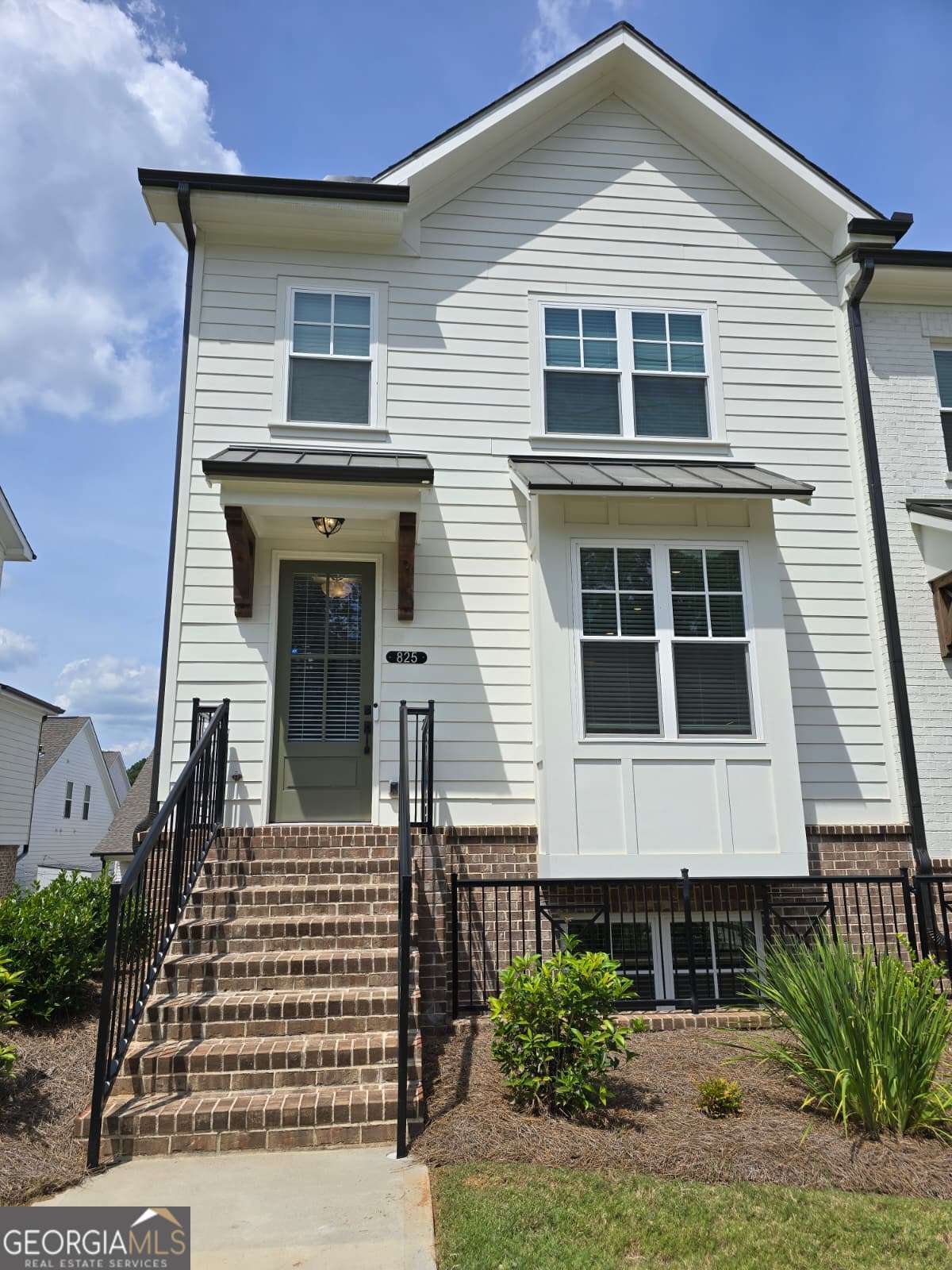 The Graham - End Unit Townhome Suwanee Farmhouse-inspired end-unit townhome offering modern style and thoughtful upgrades across 3 levels. Located in the highly desirable Harvest Park community, just 1 mile from Suwanee Town Center and walking distance to parks, trails, and schools. The terrace level features a private office or optional 3rd bedroom with full bath. The main level is filled with natural light and includes a designer kitchen with 42" cabinets, quartz countertops, oversized island with seating, and open layout to the fireside family room. A sunroom provides access to the deck-perfect for dining or relaxing outdoors. Upstairs, enjoy 2 bedrooms including a spacious owner's suite with dual vanities, large shower, and walk-in closet. No carpet-hard surface flooring throughout. Neutral finishes and crisp trim complete the clean, modern look. Community amenities include sidewalks, ample parking, and a resort-style pool. Key Features: End-unit townhome, 3 bedrooms / 3.5 baths Sunroom + deck for outdoor living Hard flooring throughout North Gwinnett Schools