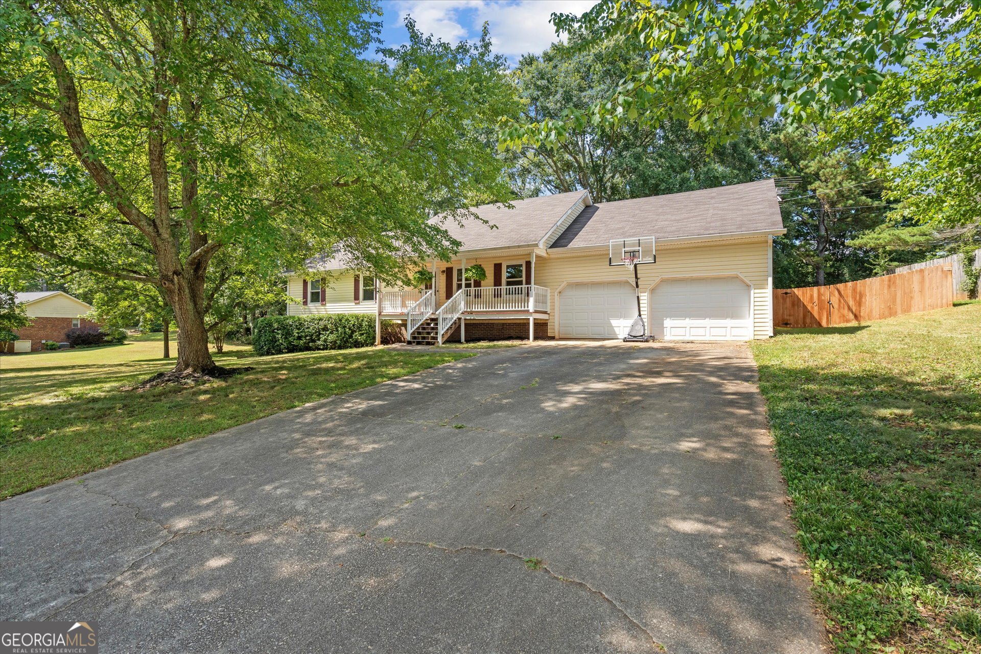 Welcome to this charming 3-bedroom, 2-bathroom ranch style home located in the established, quiet neighborhood of Triple Tree in Carrollton, GA! Great curb appeal with mature trees shading the front yard and the large fenced-in backyard. This home features a nice front porch and a brand new back deck perfect for grilling. It has freshly painted walls, new carpet in the bedrooms, new light fixtures, and a spacious kitchen with lots of cabinets that offer tons of storage along with an unfinished basement and a 2-car garage! It's also conveniently located close to shopping and restaurants. Schedule a showing today!