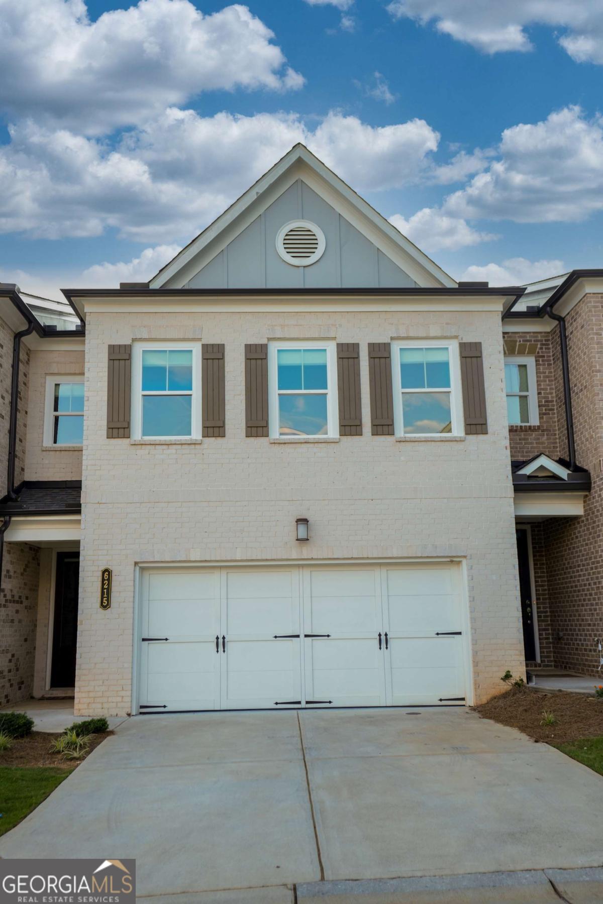 Welcome to this stunning townhome located in the desirable, gated swim community of Magnolia Walk. This beautifully maintained 3-bedroom, 2.5-bath home boasts modern finishes and a thoughtfully designed layout, making it perfect for both relaxation and entertaining. Key Features & Highlights: * LVP Flooring: Gorgeous Luxury Vinyl Plank flooring flows seamlessly throughout the main level, offering both durability and style. * Gourmet Kitchen: The chef's kitchen features quartz countertops, stainless steel appliances, and crisp white cabinets, opening to the spacious family room-a perfect space for gathering with loved ones. * Open Concept Living: The family room is flooded with natural light from a wall of windows, with a cozy gas fireplace as the focal point. The adjacent breakfast room overlooks the beautiful backyard with a private covered patio, perfect for outdoor relaxation. * Main-Level Powder Room: A charming powder room on the main level adds convenience for guests. * Two-Car Garage: Ample parking with a 2-car garage. Upstairs Retreat: * Spacious Master Suite: The master suite features trey ceilings and an ensuite bath with a separate shower and garden tub, double vanities, and an enlarged walk-in closet-providing a true retreat. * Two Additional Bedrooms: Two generously sized bedrooms share a full bath with double vanities, offering comfort and privacy for family or guests. Exterior & Location: * Private, Landscaped Backyard: Enjoy the outdoors with a beautifully landscaped and relaxing rear patio. * Convenient Location: Ideally located near downtown Alpharetta, GA 400, and top shopping, dining, and parks-Halcyon, Avalon, and Fowler Park are just minutes away. Plus, enjoy the best of Forsyth County taxes with an Alpharetta address! The HOA covers all amenities, exterior building and lawn maintenance, and trash services, making for an easy, low-maintenance lifestyle. Don't miss your chance to see this beautiful home-schedule a tour today and experience all it has to offer!