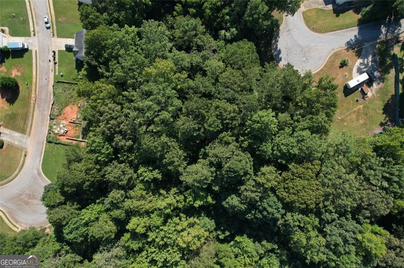 Prime Opportunity in Covington, GA Discover two beautifully wooded lots to be sold together-0.72 and 0.73 acres-perfectly positioned at the mouth of a quiet cul-de-sac. With a blend of level and gently sloped terrain, these parcels offer an ideal canvas for building your dream home, plus potential for accessory dwelling units (ADUs) tucked away at the rear. Enjoy privacy, flexibility, and the freedom of no HOA restrictions, all within a peaceful, established neighborhood. Whether you're planning a primary residence, multi-generational living, or investment potential, these lots deliver space, serenity, and endless possibilities.