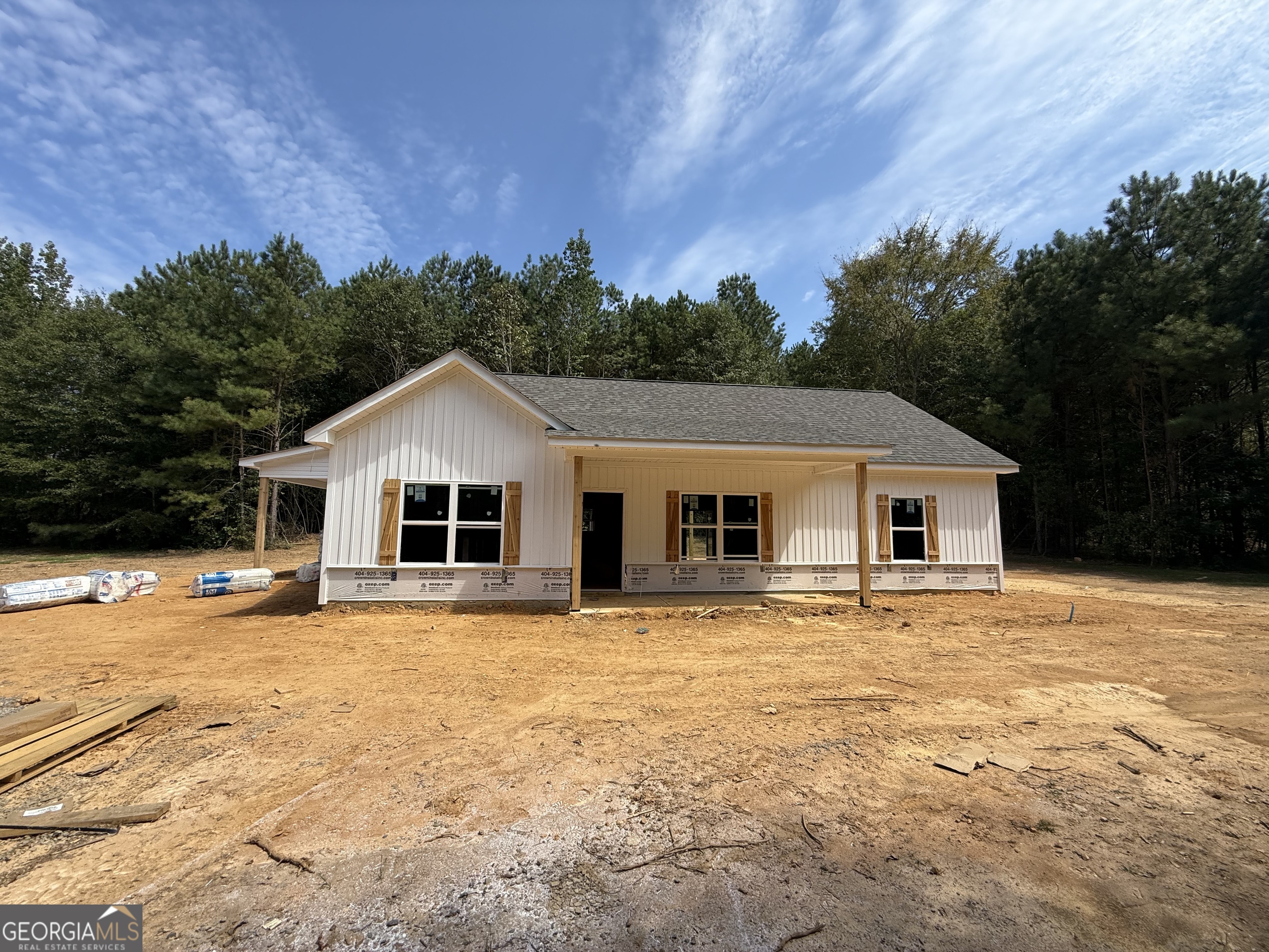 GORGEOUS NEW RANCH ON 3 PRIVATE ACRES - NO HOA, NO SUBDIVISION - JUST COUNTRY LIVING AT ITS BEST!!! Limited-time offer: Get a FREE appraisal and $3,000 in incentives when you work with our preferred lender! (Ask listing agent for terms.) Escape the hustle and bustle and come home to peace and privacy! This stepless ranch is under construction on a picturesque 3.046-acre lot in the quiet countryside north of Buchanan, just off Hwy 27 heading toward Cedartown. You'll love the easy access to town, with the comfort of your own spacious retreat. Step inside to soaring vaulted ceilings and an open-concept layout that feels light, bright, and welcoming. With 3 bedrooms and 2 full baths, there's plenty of room to spread out-and yes, there's still time to choose your finishes and make it truly YOURS! The kitchen is the heart of the home, boasting granite countertops, a counter-height bar, and a stainless steel appliance package (electric range, microwave, and dishwasher included!). The private owner's suite is your getaway, complete with a large walk-in closet, double vanities, framed mirrors, granite countertops, and a sleek stand-up shower. Two generously sized secondary bedrooms share a stylish full bath with granite vanity and tub/shower combo. You'll also enjoy ceiling fans in the living room and owner's suite for added comfort. Outside, the home will feature easy-care vinyl siding with a stone water table for extra curb appeal. Don't miss this rare opportunity to build your dream home in the country-with room to breathe and no pesky HOA! ***Photos are representative and not of the actual home.***Construction is underway - contact the listing agent today!***