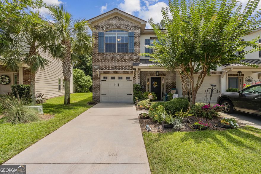 This end unit townhome in The Reserve at Demere offers a fantastic blend of comfort, style, and location-with easy access to the island's causeway and situated right along the edge of the Sea Island Golf Course Hole 4. It's less than two miles from the beach, and you'll love the light-filled living room, beautiful hardwood floors downstairs, and crown molding in most rooms. The foyer opens to handy storage closets and a powder room with a travertine counter. Throughout the home, you'll notice thoughtful details like cottage-style doors with matte black hardware. The HVAC is just two years old and includes UV light technology for cleaner indoor air. Downstairs, the open layout makes it easy to entertain, with the kitchen flowing right into the dining and living areas. The kitchen is fully equipped with stainless steel appliances, including a Bosch refrigerator and dishwasher. You'll also find a pantry, granite countertops, under-cabinet lighting, and a raised breakfast bar at the island-plus extra storage underneath and beadboard cabinet fronts that give it extra charm.  Upstairs, all the bedrooms and hallway have LVP flooring (no carpet here), with tile in the bathrooms and laundry. The primary suite has a standard closet plus a large walk-in, and the attached bath features a soaking tub, separate tiled shower, double vanity with travertine counters, travertine flooring, a water closet, and lots of space to get ready. Two more bedrooms are upstairs-one with a vaulted ceiling and the other with crown molding-plus a guest bath and a laundry room with cabinets for storage. Out back, enjoy a peek at the golf course from your open patio, or take advantage of the roomy side yard. There's also an attached one-car garage with automatic opener and keypad. Bonus: the living room TV and one bedroom TV will stay with the home. And if you're looking for a place with low maintenance and high convenience, you'll love that the community pool is just steps away and no flood insurance is required. This home makes a great full-time residence, seasonal escape, or rental investment-especially for FLETC folks-just minutes from Saint Simons Island's beaches, restaurants, and shops. Easy living with easy access on and off the island.