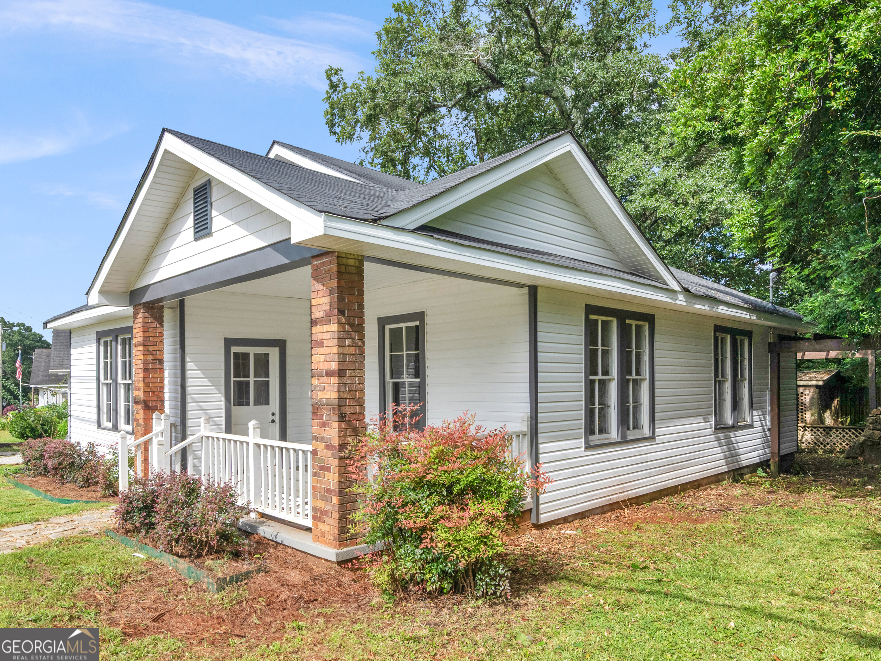 Thomaston charm invites you to 328 S. Green Street. Fresh paint, refinished floors, tall ceilings, and natural light highlight this 4BR/1.5BA home. The dining room makes a bold statement with its accent wall and lighting, while the kitchen blends modern updates with open shelving and ample cabinetry. Both bathrooms are located on the main floor, including a refreshed full bath and a convenient half bath. The home features two bedrooms upstairs and two on the main level for flexible living. Outside, enjoy a covered front porch, brick accents, mature trees, and a location just minutes from downtown, schools, and shopping. Ask about $0 down payment and closing cost assistance-schedule your showing today!