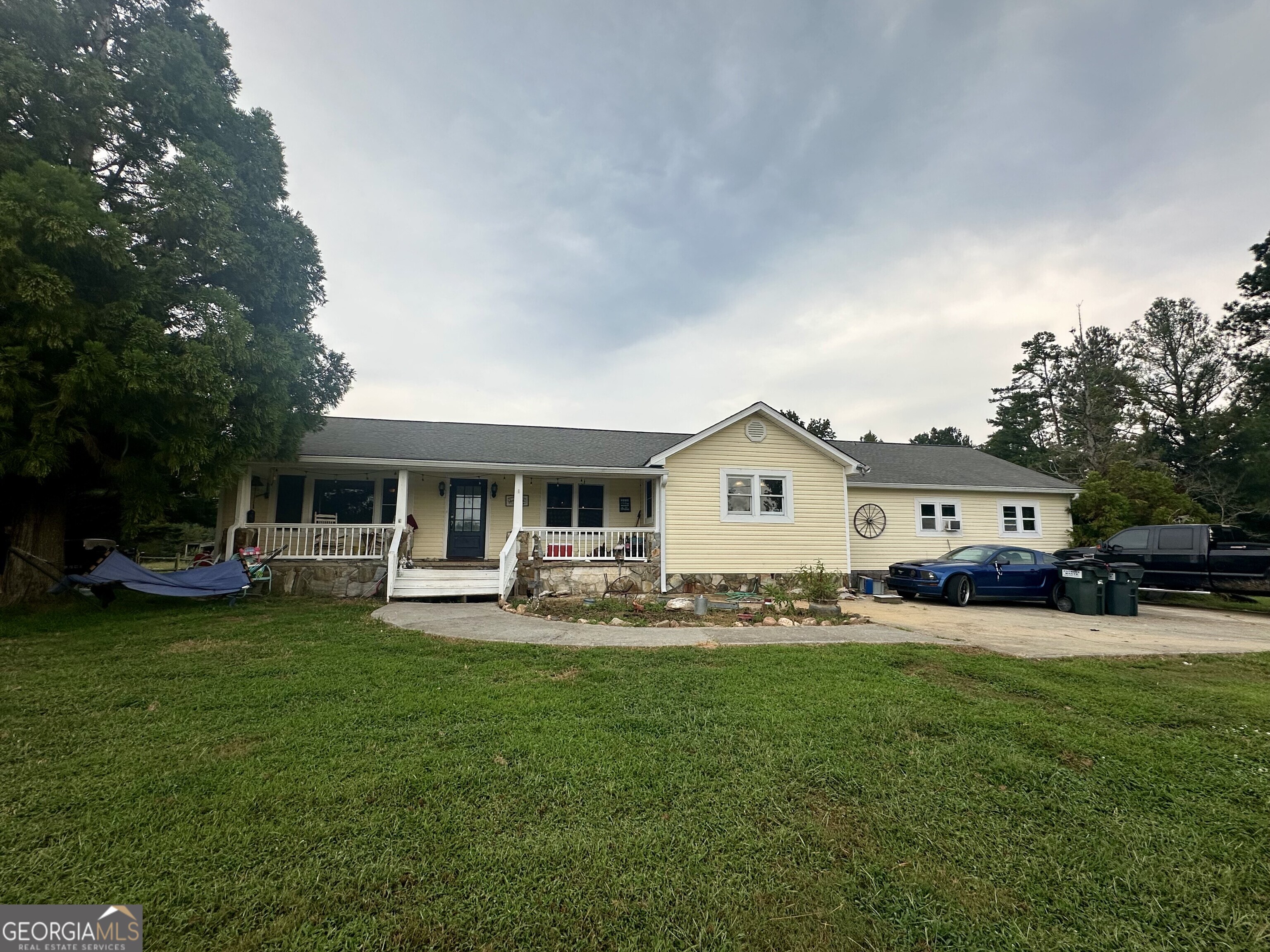 Spacious home on 5 acres located near the Tallapoosa River with 4 bedrooms, 3 full baths, and a dedicated office or small bonus area. Features include a pool with pool house, workshop/garage, and large outdoor space. Tax records reflect 2,501 sq ft, but the enclosed carport brings the estimated total to approx. 3,487 sq ft (buyer to verify). Home needs repairs and updates but offers excellent potential. This is the perfect place to start your mini farm, homestead, or simply enjoy country life with a little sweat equity! Selling AS-IS!