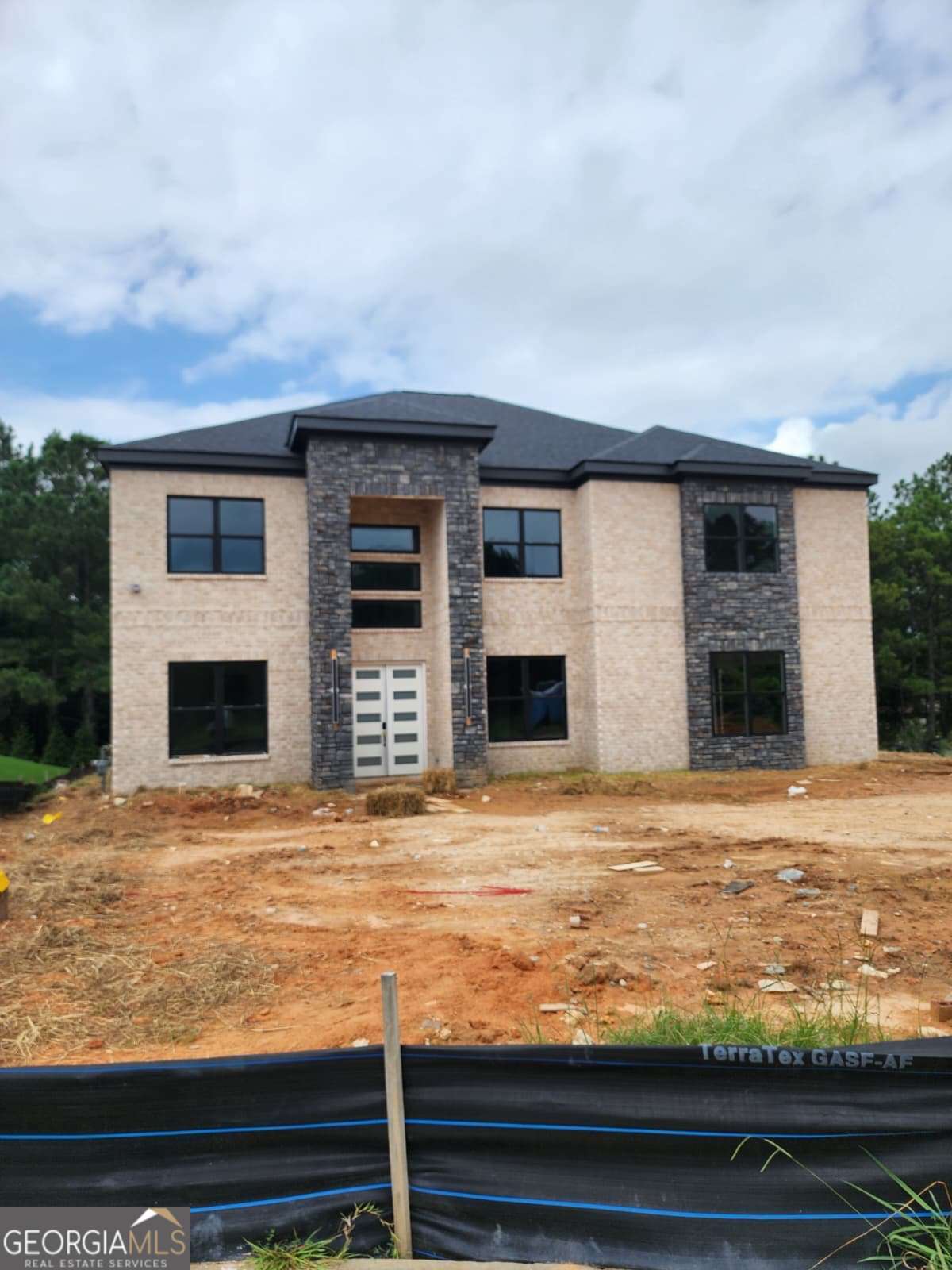 This is a stunning new construction custom home in luxury Le Jarden Subdivision which features a 4 side brick house which is 4,414 sqft with 5 bedrooms and 51/2 baths. The grand entry foyer with captivating crystal Chandelier welcomes you to the open concept mix of traditional, modern and Craftsman design with Gourmet kitchen. This open concept home features formal living room, formal dining, All Hardwood flooring, gourmet kitchen, stainless steel appliances, breakfast area, large laundry, 10ft high great room flanked by custom shelving and electric fireplace. The Kitchen counter, Island and all the baths are quartz and porcelain tiles. The interior trim details is top notch and level of detail is next level. There is a another living room with a fireplace upstairs ready to be used for entertainment and relaxation. Master Bedroom has it's own fireplace, siting area, double foyer and features a spacious master bathroom with quartz counter tops, porcelain tiled shower, upgraded plumbing features, soaking freestanding tubs, separate vanities, private toilet and expansive walk in closet with built in cabinet. Secondary bedrooms are large with each having a bathroom. This house is very close to the Airport, downtown and Shopping.