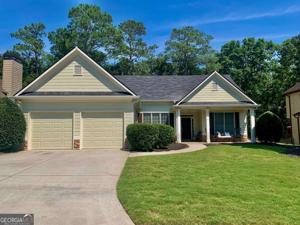 Welcome to this Beautiful Ranch home, nestled in the sought-after Bridgemill subdivision! This charming ranch home offers three spacious bedrooms and two full bathrooms! Exterior was just painted, New garage doors, Roof, and gutters replaced (2022) two guest bedrooms and guest bathroom recently painted and new blinds put in those bedrooms. W/D & Refrigerator stays with the sale of the home. Step inside to discover an inviting foyer entrance with an architectural arch that leads to an open-concept living space, accented with gleaming hardwood floors and a cozy stone fireplace perfect for relaxing or entertaining. The oversized master bedroom has double tray ceilings and boasts a generous walk-in closet! The well-appointed kitchen features granite countertops, modern S/S appliances, ample cabinetry, a pantry and a convenient breakfast area with a breakfast bar. Outside, the home's stone-accented facade adds character and curb appeal along with the newly sodded front yard and underground sprinkler system! The backyard is private with a patio and view of the woods with plenty of room for your kids or pets to run, inside the wrought iron beautiful fence. Bridgemill Subdivision has top-tier amenities, including the Bridgemill Pool, a resort-style aquatic center with slides and diving boards, perfect for summer fun! An award-winning golf course, restaurant, pickleball, basketball courts, tennis courts and more! SELLERS OFFERING $10,000 for FLOORING & PAINTING ALLOWANCE! Can be used towards closing costs or buy down your interest rate. Sellers never lived at home. Sellers are owners on deed so no probate issues.
