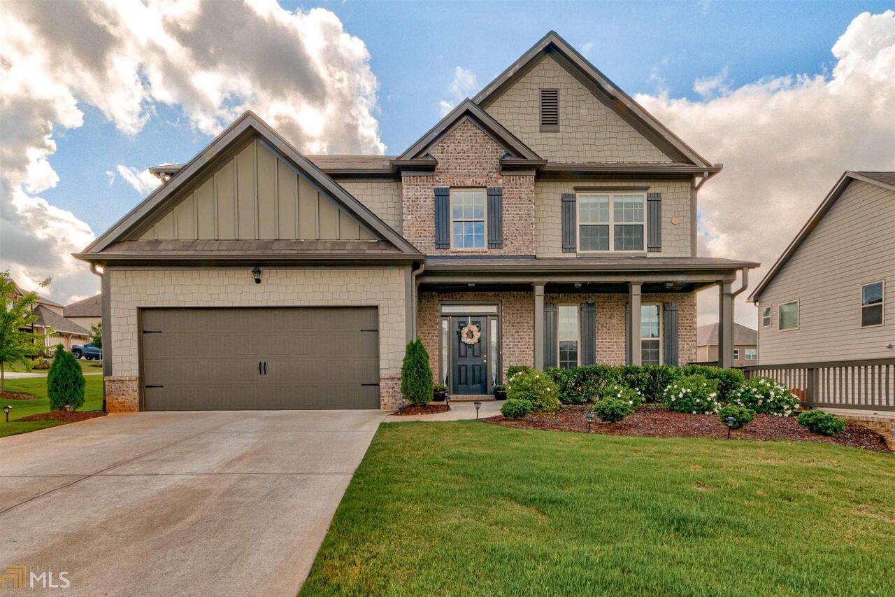 Hurry to see this fabulous, nearly new home in desirable neighborhood. Home features gleaming hardwoods throughout main floor and spacious open floor plan, with kitchen open to family room. You'll love the gourmet kitchen, complete with granite countertops, stainless steel appliances, tile backsplash and walk-in pantry. And double ovens for those holiday meals! Bedroom (or office) on main with full bathroom, perfect for guests. Upstairs is the master suite, with spa-like master bath with double vanities. Three additional bedrooms, including one with en-suite bath.Enjoy a beverage on the private back fenced yard and patio area. Walk to the pool or playground, just down around the corner!