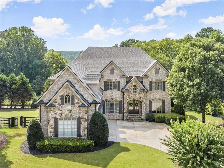 STUNNING EXECUTIVE ESTATE in the prestigious MILTON community of Arcaro at Triple Crown! This SPECTACULAR CUSTOM-BUILT home on 1.01 acres is an  ENTERTAINERCOS DREAM! Upon entering through the beautiful CUSTOM FRENCH DOORS, you are welcomed by a FANTASTIC 2-STORY OPEN FOYER flanked by a distinguished STUDY and an OVERSIZED dining room. As you pass through you will be enamored with the GORGEOUS living room featuring COFFERED CEILINGS, a wall of WINDOWS, a cozy FIREPLACE, and custom built-in BOOKCASES. You are sure to love the IMPRESSIVE CHEFCOS KITCHEN, complete with STAINLESS HIGH-END APPLIANCES, LUXURIOUS QUARTZ COUNTERTOPS, FARMHOUSE SINK, MASSIVE ISLAND, and a SPACIOUS WALK-IN PANTRY.a DonCOt miss the convenient COFFEE BAR adjacent to the LARGE BREAKFAST AREA in the kitchen. This AMAZING KITCHEN is open to the COMFY, YET SPACIOUS, KEEPING ROOM w/ VAULTED CEILING, GERMAN SCHMEARED STONE FIREPLACE and FRENCH DOORS. Sip your morning coffee on the large SCREENED-IN-PORCH/deck that overlooks the PRIVATE BACKYARD with the PERFECT SPOT FOR A FUTURE POOL. Beautiful WIDE PLANK HARDWOOD floors, LUSH MOLDING, UNIQUE MILL WORK, and ON-TREND LIGHTING beautify the home. The main level also features a PRIVATE GUEST ENSUITE as well as a Mudroom with a built-in desk area and TWO ADDITIONAL HALF BATHS. Upstairs you will find the SPRAWLING MASTER SUITE featuring GLEAMING HARDWOODS, a lit TREY CEILING, a large FLEX SPACE, and one of the largest CUSTOM MASTER CLOSETS you will ever see! Enjoy the ELEGANT SPA-LIKE MASTER BATHROOM, featuring QUARTZ Countertops, LUX CABINETRY, an OVERSIZED shower, and a relaxing SOAKING TUB.a Upstairs you will also find 3 OVERSIZED, BRIGHT secondary bedrooms each with its own ENSUITE, a LOFT area perfect for watching TV or working, and an OVERSIZED laundry room w/BUILT-IN CABINETS and sink, making laundry very CONVENIENT! Make your way down to the FULLY FINISHED DAYLIGHT TERRACE LEVEL featuring WIDE PLANK LUXURY FLOORING and LOADS OF WINDOWS. This EXPANSIVE lower level offers another FABULOUS family room, a fully furnished KITCHEN, an oversized bedroom, and a full bath with a WALK-IN SHOWER, perfect for an IDEAL IN-LAW or TEEN SUITE! In addition, this terrace level boasts a finished space that is intended to be a perfect WINE CELLAR/BURBON BAR COMBINATION and EXERCISE ROOM. Yet there is still an ample amount of unfinished storage as well. DonCOt forget the oversized 3-car SIDE ENTRY GARAGE with epoxied floors! This BEAUTIFULLY maintained community is just minutes away from AWARD-WINNING SCHOOLS, SHOPPING, RESTAURANTS, PARKS, TRAILS, and ACTIVITIES that downtown MILTON/CRABAPPLE has to offer. MAKE YOUR APPOINTMENT TODAY. HOME IS A MUST-SEE!