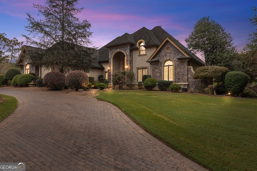 Welcome to a truly majestic residence nestled in the foothills of the North Georgia Mountains-where luxury, craftsmanship, and natural beauty converge in perfect harmony. This architectural gem spans three levels of refined living, beginning with a grand two-story oak spiral staircase that sets a timeless and elegant tone throughout the home.  Main Level Highlights:  Primary Suite on the Main with a private sunroom, offering a peaceful retreat.  Formal living room with fireplace and a formal dining room for elegant entertaining.  A private library, ideal for work or relaxation.  Full kitchen with adjacent keeping room featuring a fireplace-the heart of the home.  Upper Level: Three spacious bedrooms, two full bathrooms, and a cozy sitting area, perfect for guests or family. as well as Theatre room and Workout Room.  Terrace Level: One bedroom suite, 1 full and 1 half bathroom.  Private office, comfortable living room with fireplace, full kitchen, and den-a perfect setup for multigenerational living  Exterior entrance for added privacy and convenience, plus a separate storage room.  Outdoor Living: Exquisitely landscaped and terraced grounds featuring a waterfall, pond, and stone landings-ideal for entertaining or enjoying the breathtaking year-round views.  Detached sunroom with a fireplace and outdoor cooking area, perfect for gatherings. IPE deck with a spiral staircase leading to a tile patio, expanding your outdoor enjoyment.  Five-car garage providing ample space for vehicles, hobbies, or storage.  This estate is a rare blend of mountain serenity and sophisticated design-offering an unparalleled lifestyle in one of North Georgia's most scenic settings. Listing Agent is related to the Seller.