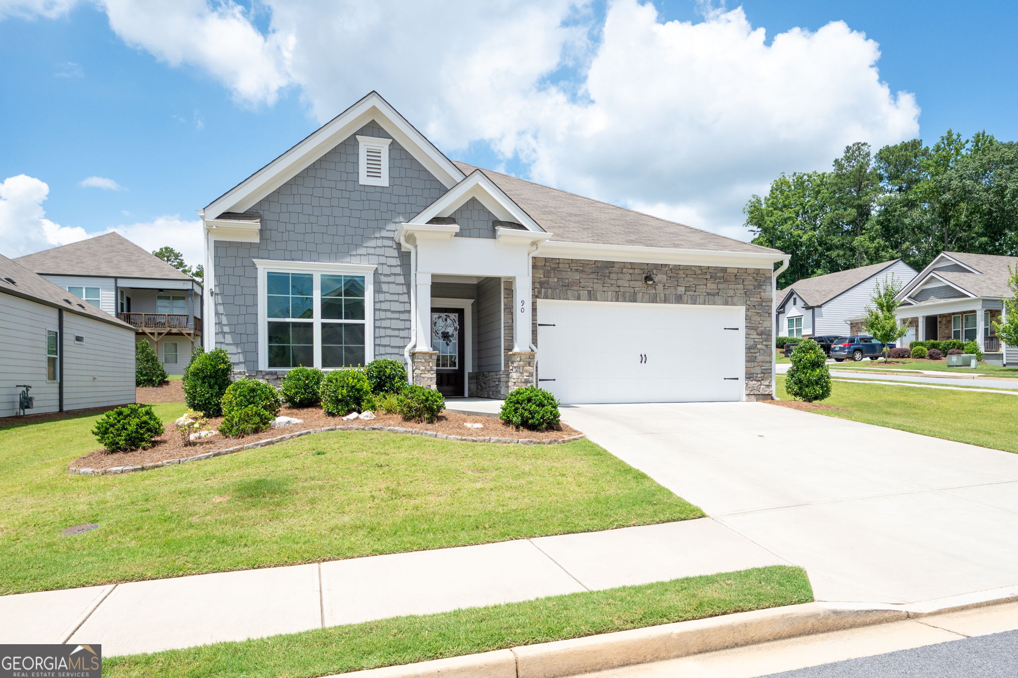 Gorgeous 5-Year-New Ranch Home on Corner Lot with amazing upgrades and updates! This beautifully well maintained ranch-style home is ideally situated on a corner lot within easy walking distance to top-tier community amenities. Featuring an open concept floor plan, the home offers a spacious and inviting atmosphere perfect for everyday living and entertaining.The chef's kitchen is a showstopper, boasting a center island, stainless steel appliances, custom pull-out shelving, and built-ins in the walk-in pantry. The kitchen seamlessly flows into a large great room with a cozy fireplace and an open dining area, creating the perfect gathering space. The primary suite is conveniently located on the main level and offers a luxurious, spa-like bath with a large tiled shower, double vanities, a linen closet with custom built-ins, and a private water closet. You'll also love the custom built-ins in the expansive primary walk-in closet. Two additional generously sized bedrooms and a full secondary bathroom provide plenty of space for family or guests. Additional features include: Screened porch perfect for relaxing outdoors and fenced yard for privacy and pets. New interior and exterior paint (2023), new carpet in bedrooms (2023), new garage epoxy floors and a new garage door opener, and whole-house surge protector for peace of mind. This move-in-ready gem combines comfort, style, and functionality in a prime location. Luxurious amenities include pool and clubhouse! Welcome Home!