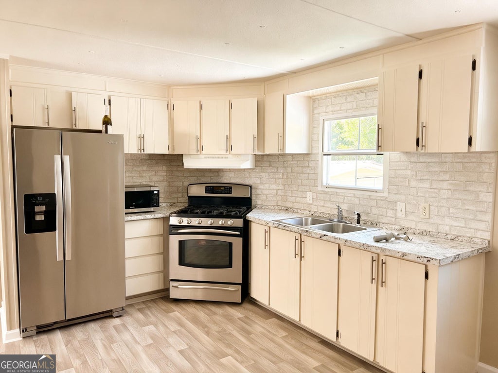 Photo of 5019 Dickshill Pkwy, Mount Airy, GA 30563 (MLS # 10850569)