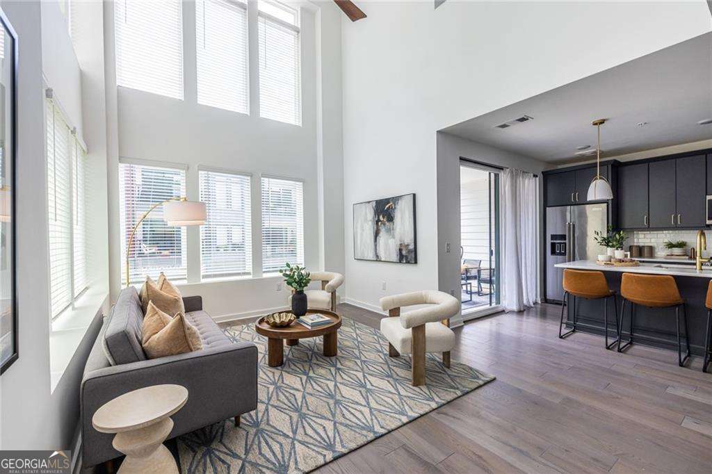 Looking for a sophisticated Beltline Beauty--well look no further. This grand home is literally 10 steps to the beltline with a two story atrium overlooking the tree lined trail and the restaurants at The Beacon are at the end of the street providing the intown lifestyle of your dreams. This home provides an abundance of space and is flooded with light-- walk up from your garage and be enveloped in the natural light from the 2 story atrium living room that flows seamlessly into the dining room and the stunning kitchen with dark cabinets, white stone countertops, designer lighting and professional grade appliances . Entertain guests in one of 3 private outdoor living spaces. The primary suite is on the main level with walk in closet and spa like bath. Upstairs is a loft space overlooking the atrium and another outdoor living space. The Secondary bedrooms are nice size and share a bathroom with a double vanity. The floor plan allows such flexibility--it would be great for roommates, guests and an office or kids could take over the entire second floor. What really strikes me in this home is the scale of the living spaces, the well thought out floor plan, the 3 private outdoor spaces and the amount of light that fills all the spaces--it is on a corner so there are large windows in every room. What a happy home, that is stylish and functional right on the beltline. The neighborhood is lively with energy and ease. Walk everywhere--to the east is Grant Park ,Glenwood Park and the Memorial Drive Corridor. Don't miss this one , there isn't another one like it! It is truly unique in all the right ways.